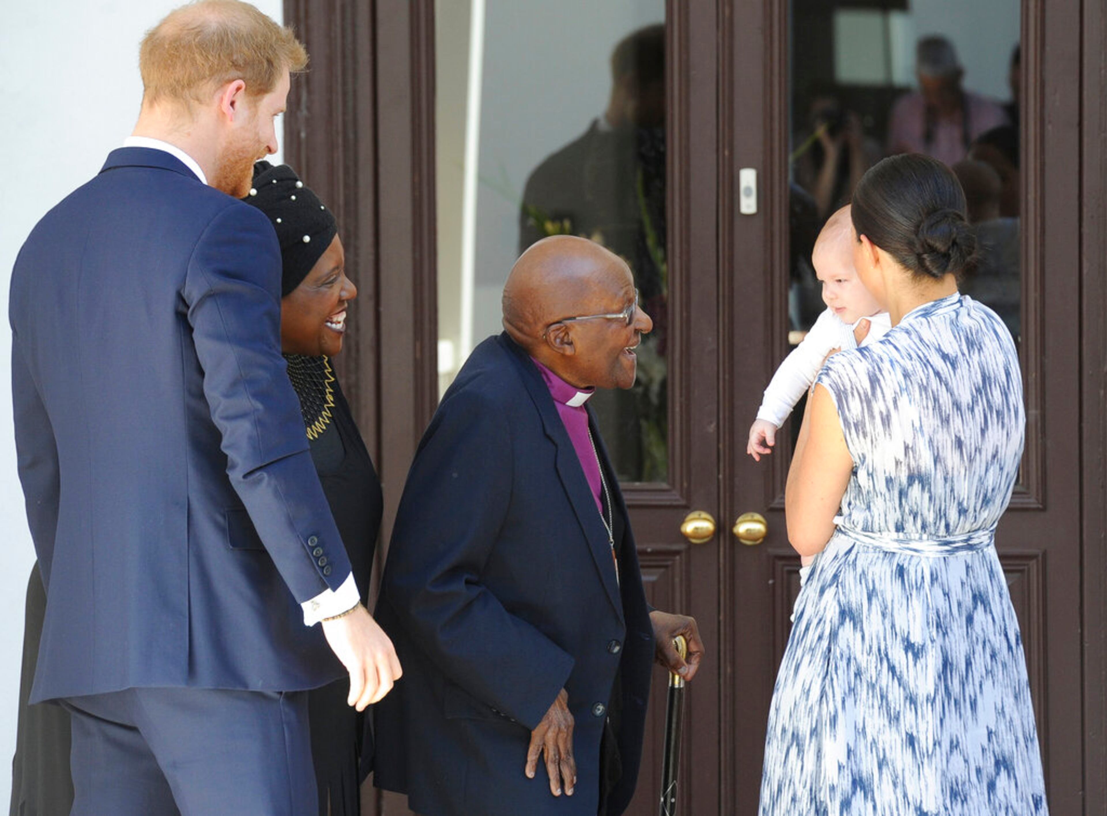 Britain's Prince Harry and Meghan, Duchess of Sussex, holding their son Archie, meet with Anglican Archbishop Emeritus, Desmond Tutu in Cape Town, South Africa, Wednesday, Sept. 25, 2019. The royal couple are on the third day of their African tour. (Henk Kruger/African News Agency via AP, Pool)