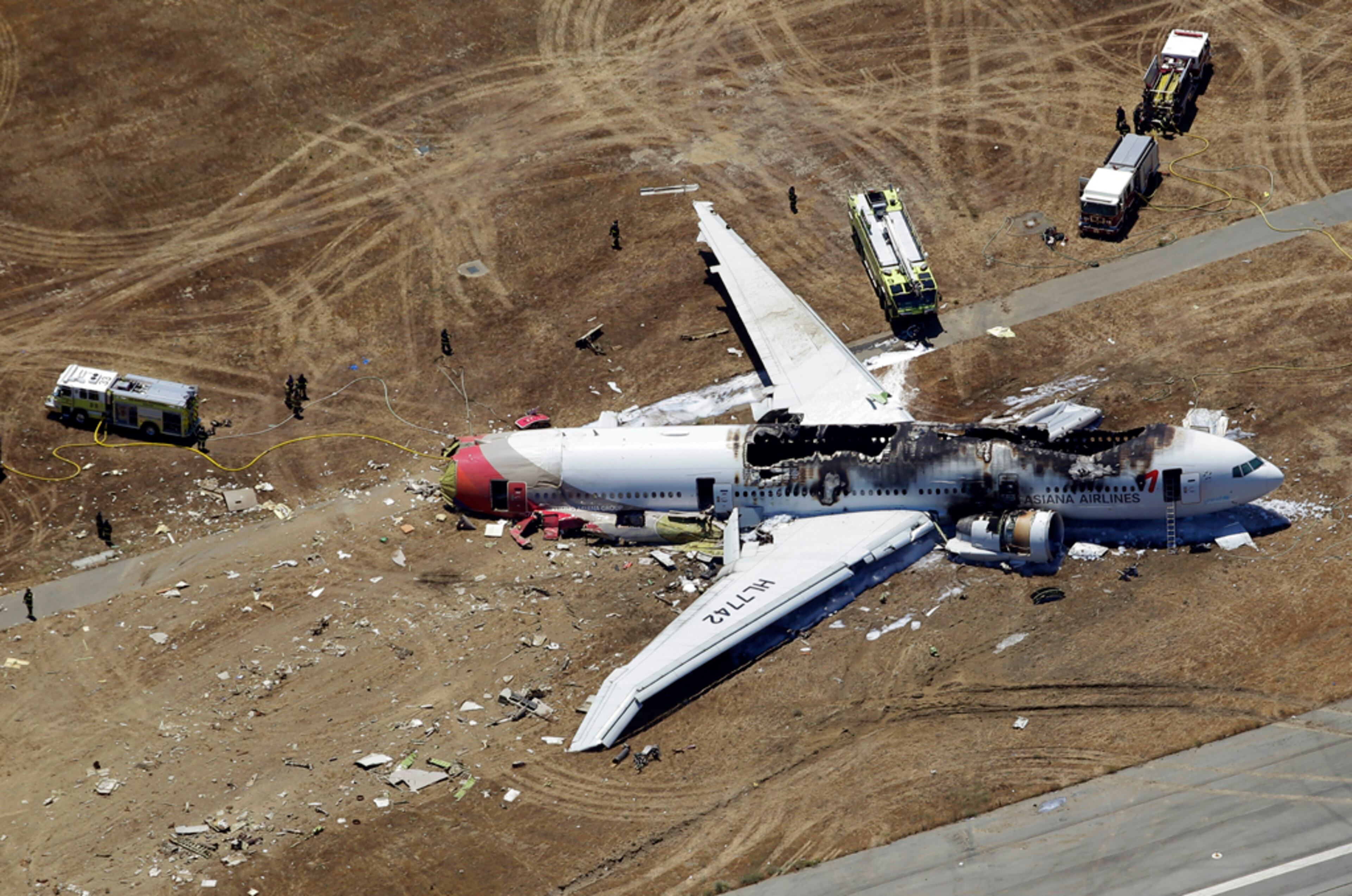 This aerial photo shows the wreckage of the Asiana Flight 214 airplane after it crashed at the San Francisco International Airport in San Francisco, Saturday, July 6, 2013. (AP Photo/Marcio Jose Sanchez)
