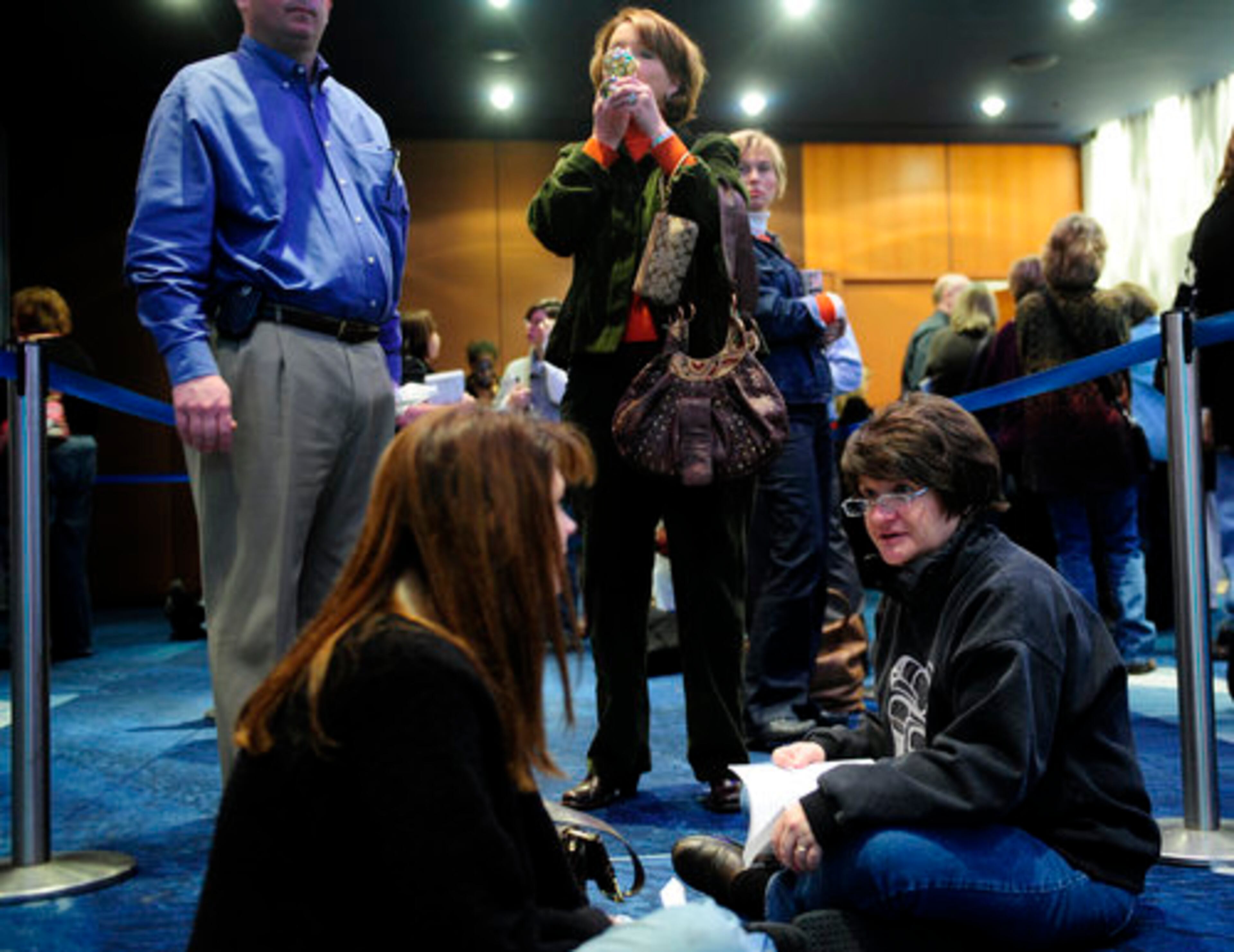Michelle Clay (seated, left), 39, of Dallas, Ga., talks to Karin Brooks, 59, of White, while Laura Latimer, 58, of Cumming fixes her face in a compact mirror. "Sometimes I feel like Martha Stewart," Latimar said.