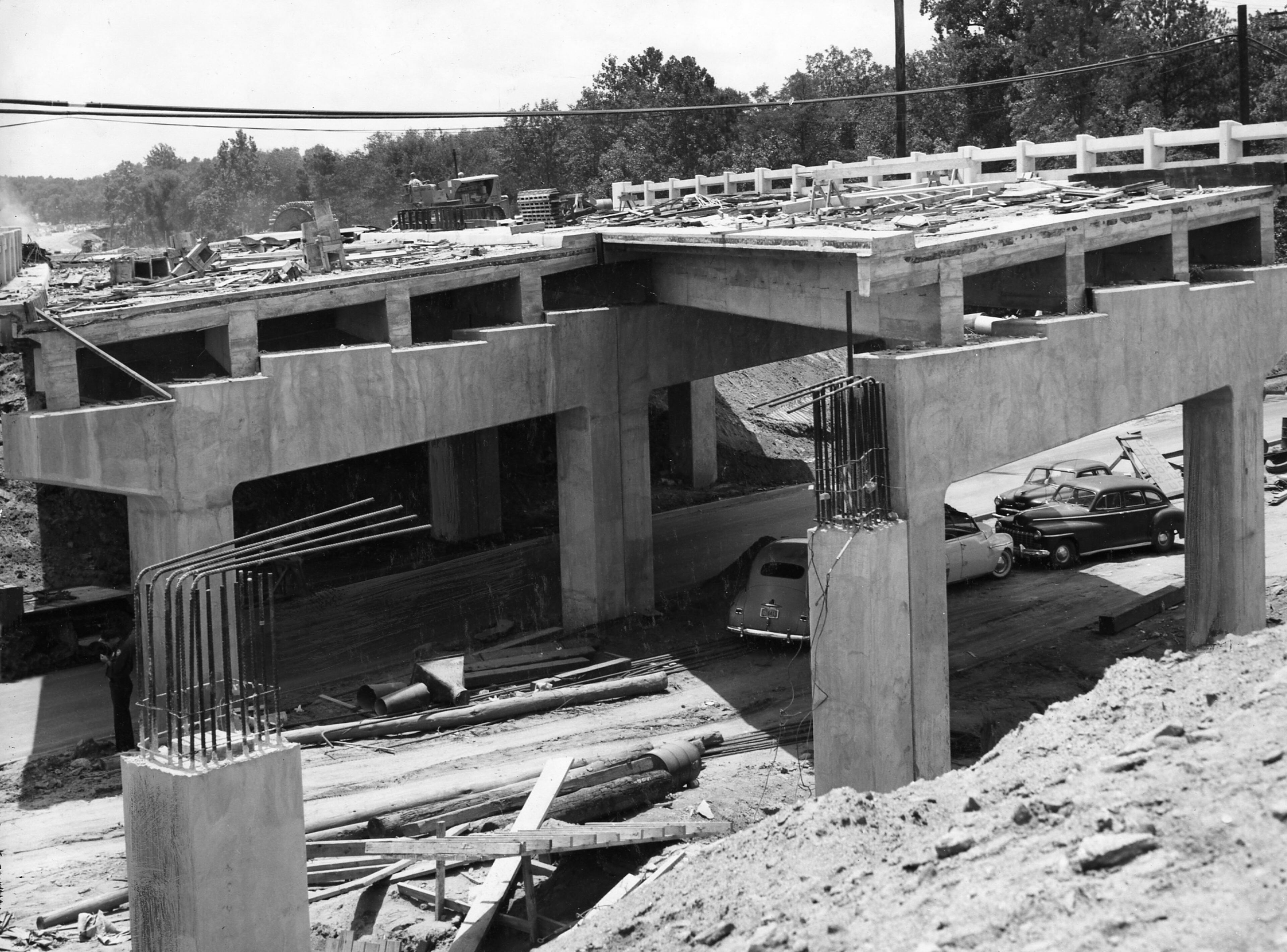 Atlanta, GA - (1st of 3 photos) - Lindbergh Drive bridge built in separate stages. Span with gentle curve has thee of four deck sections completed. (Van Toole/AJC staff) 1954