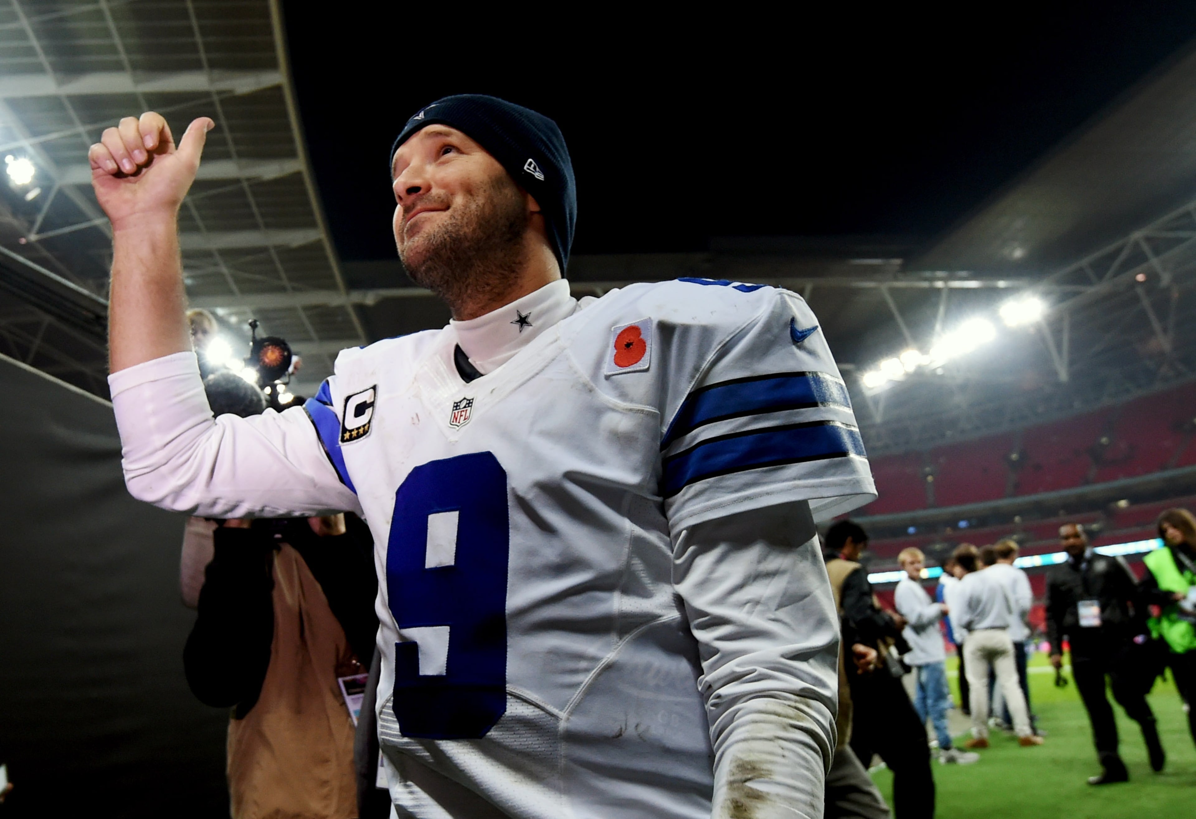 Dallas Cowboys quarterback Tony Romo gives a thumbs up after their 31-17 victory over the Jacksonville Jaguars during the NFL football game at Wembley Stadium, London, Sunday, Nov. 9, 2014. (AP Photo/Tim Ireland)
