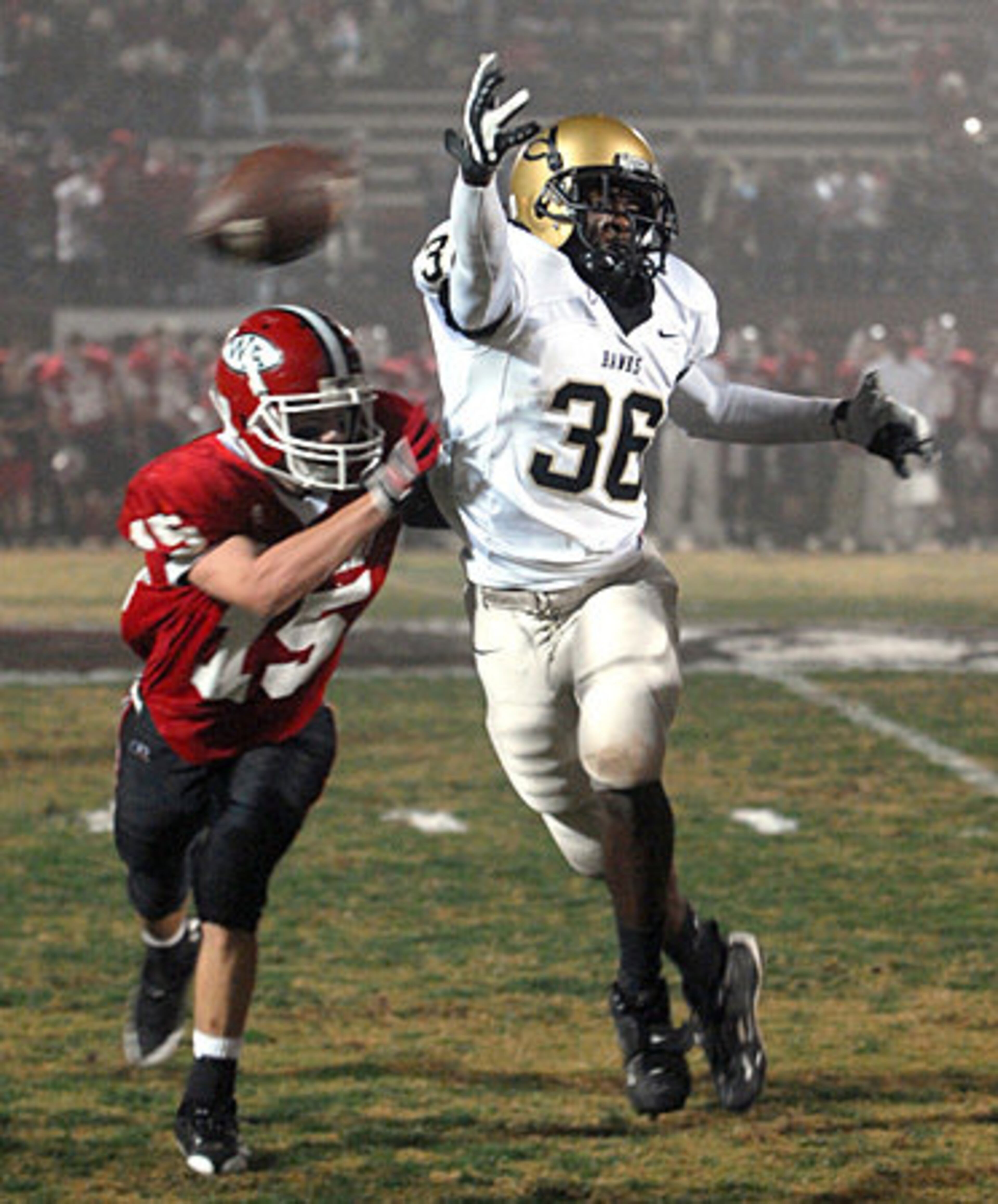 Caddarius Warthen (36) of Washington County almost snags a second-quarter pass as Woodward's Josh Clark (No. 15) plays close defense.