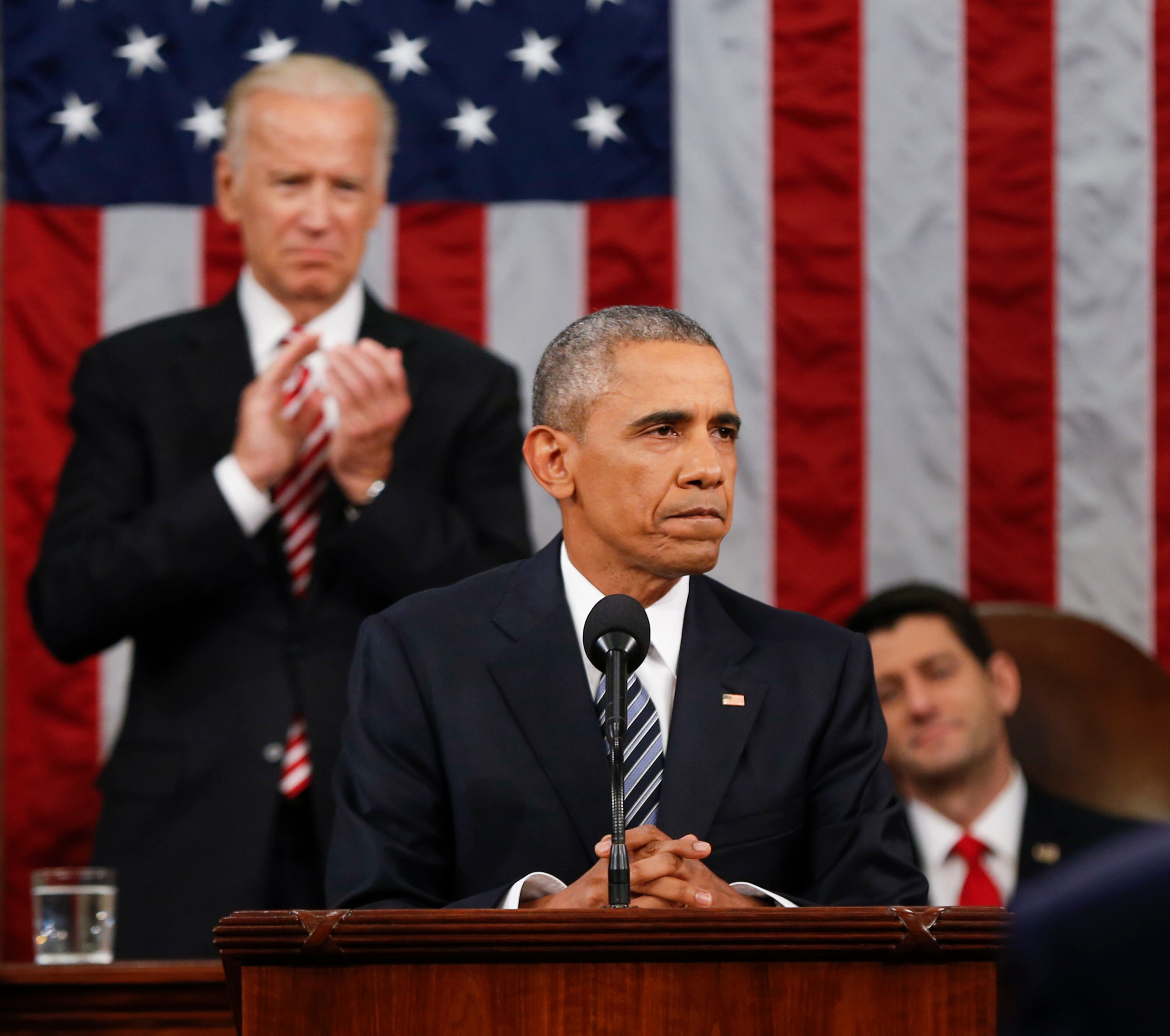 Vice President Joe Biden applauds as Speaker Paul Ryan of Wisconsin listens to President Barack Obama's State of the Union address before a joint session of Congress on Capitol Hill in Washington, Tuesday, Jan. 12, 2016. (AP Photo/Evan Vucci, Pool)