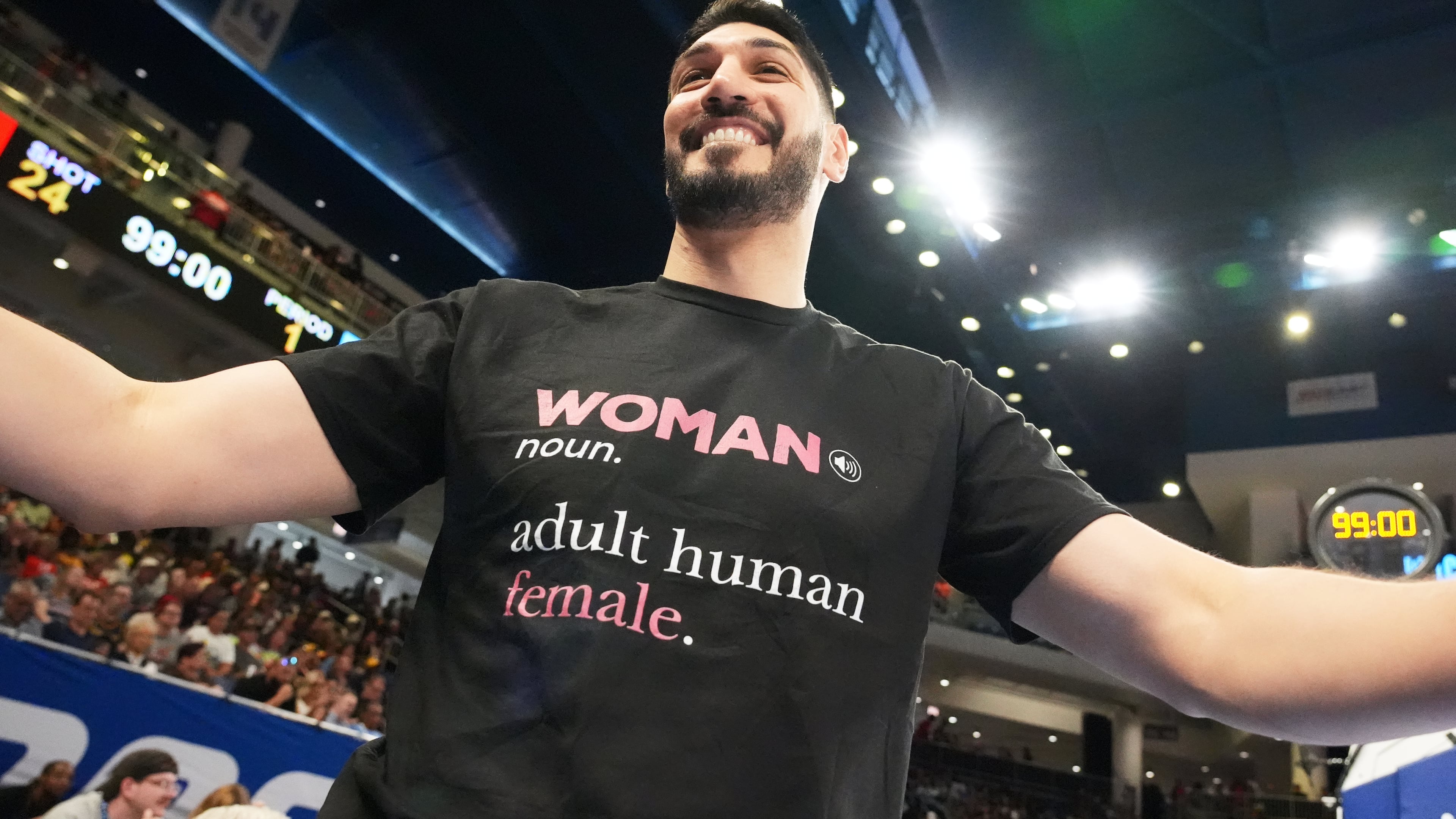 Former NBA center Enes Kanter Freedom greets a friend before a WNBA basketball game between the Indiana Fever and the Chicago Sky, Sunday, Aug. 23, 2026, in Chicago. (AP Photo/Nam Y. Huh)
