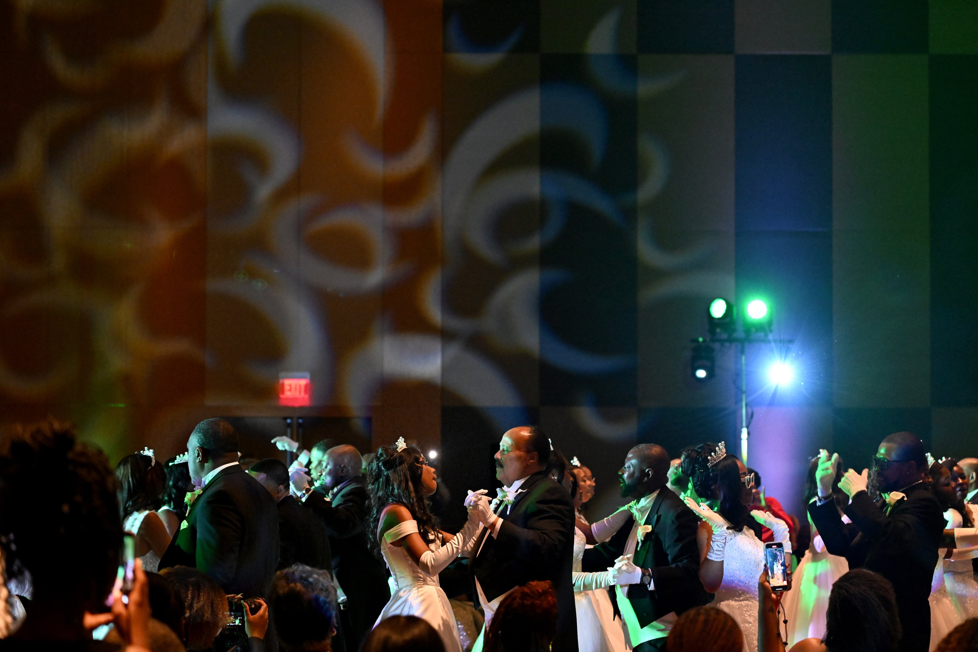 Debutante Yolanda Renee King (center) dances with her father ,Martin Luther King III, during the 2026 Pink Cultured Pearls Cotillion on March 29. (Hyosub Shin/AJC)