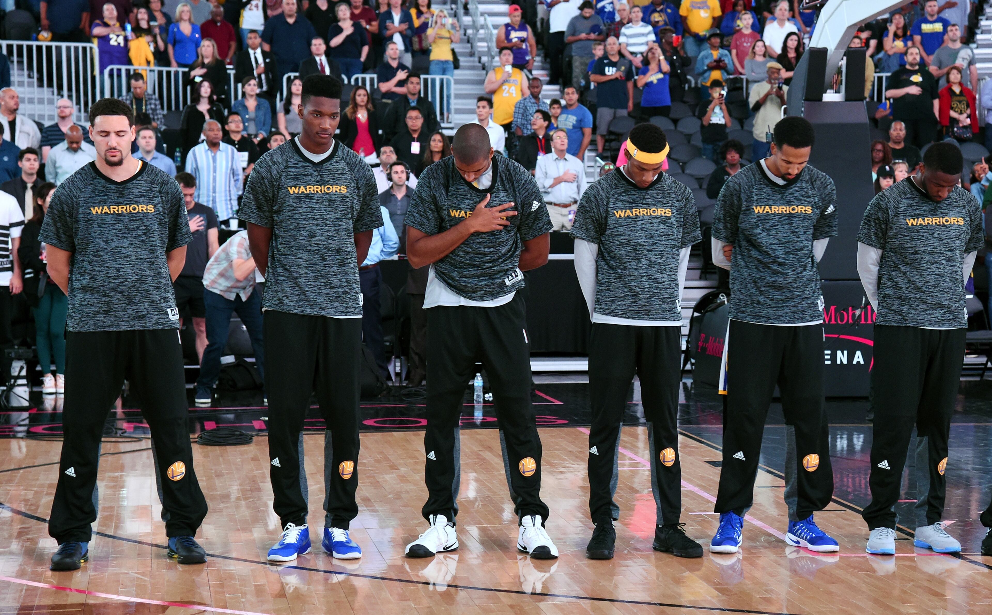 Members of the Golden State Warriors stand on the court as the national anthem is performed before their preseason game against the Los Angeles Lakers at T-Mobile Arena on October 15, 2016 in Las Vegas, Nevada. Golden State won 112-107. (Photo by Ethan Miller/Getty Images)