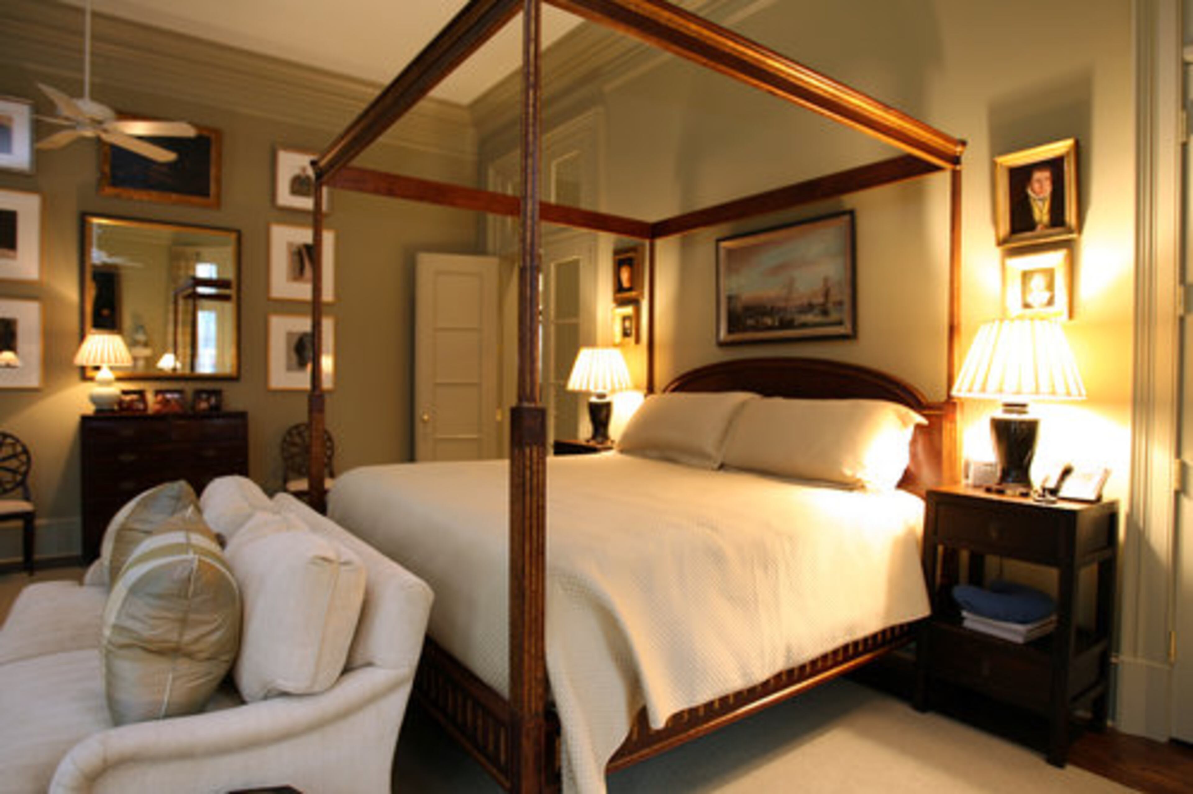 The master bedroom contains paintings from the 17th and 18th centuries. Murphy says if you don't have enough pieces to avoid mixing them, "buy each other art for all gift-giving occasions."