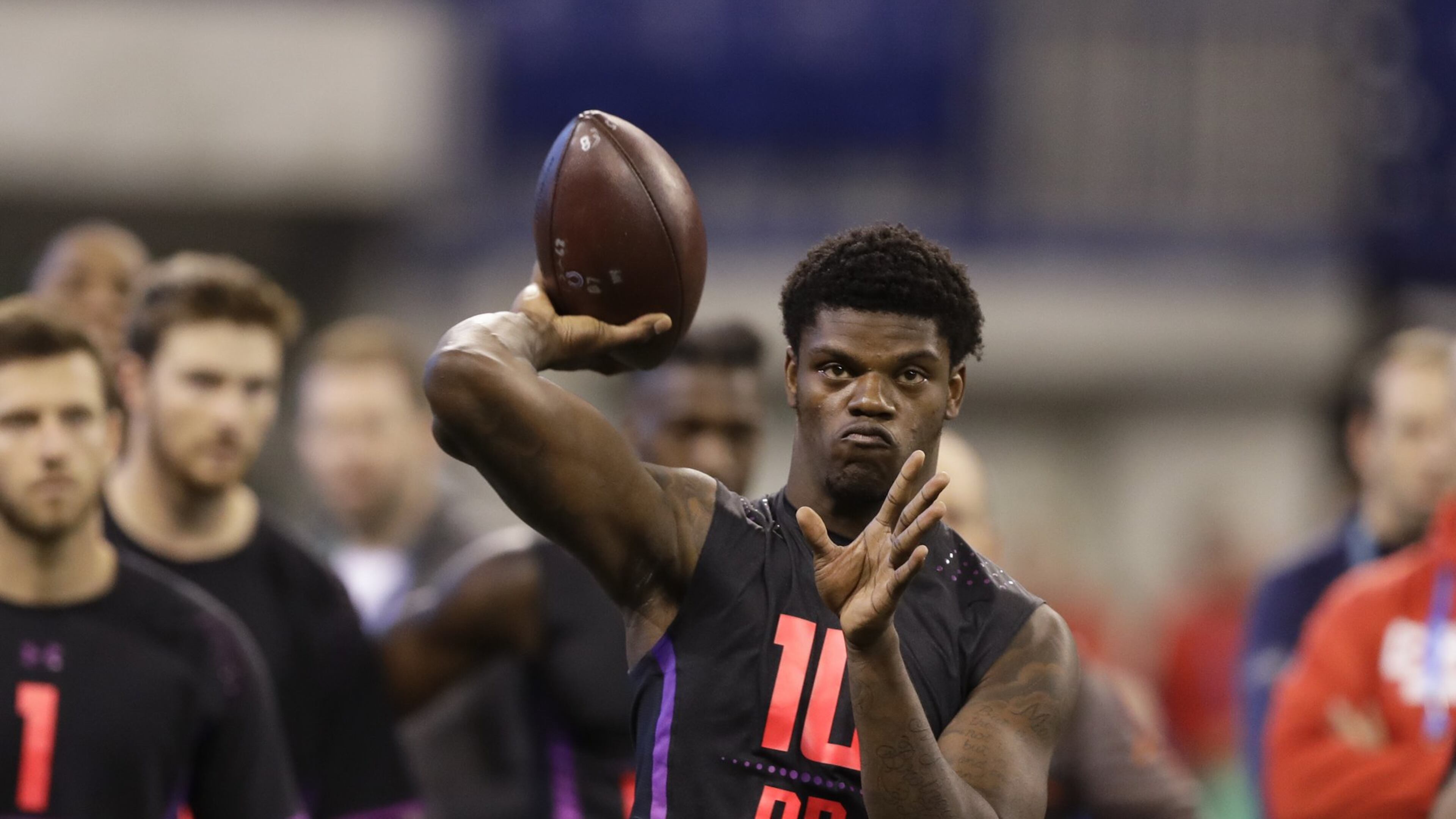 Louisville quarterback Lamar Jackson throws during a drill at the NFL football scouting combine, Saturday, March 3, 2018, in Indianapolis. CREDIT: Darron Cummings/Associated Press