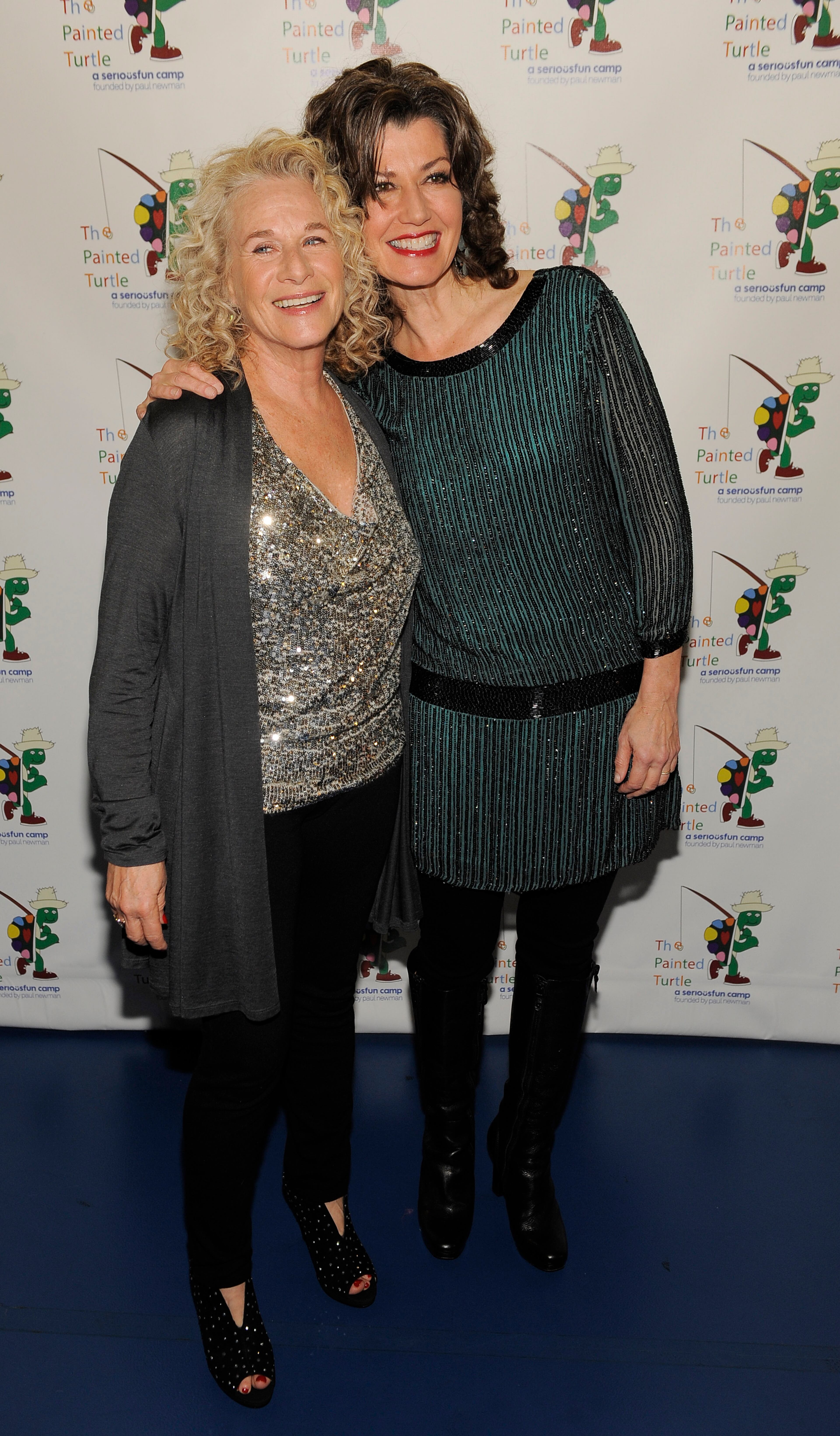 Singer-songwriter Carole King, left, poses with guest performer Amy Grant at A Celebration of Carole King and her Music at The Dolby Theatre on Tuesday, Dec. 4, 2012, in Los Angeles. (Photo by Chris Pizzello/Invision/AP)