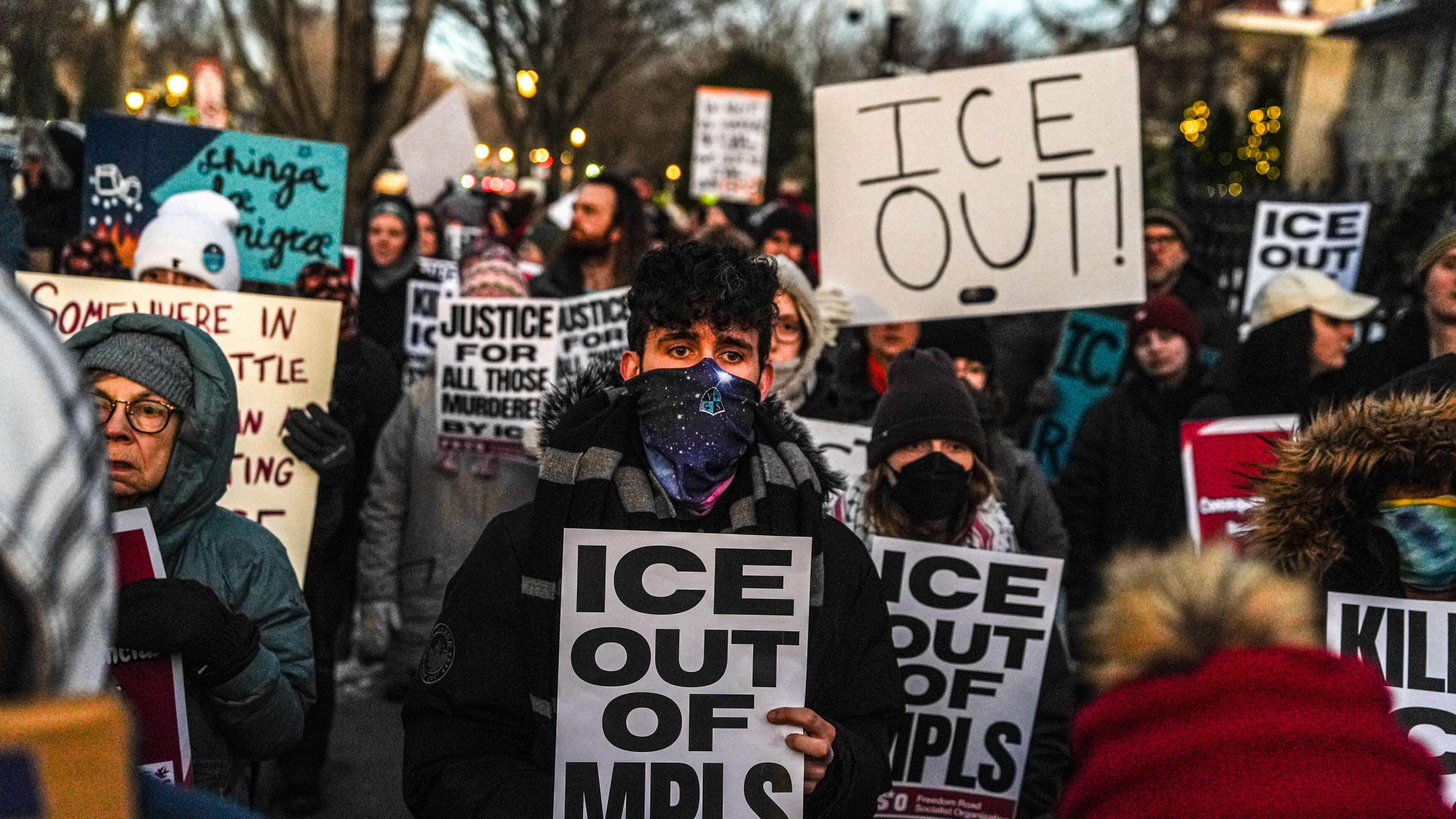 People participate in an anti-ICE protest outside of the Governors Residence, Friday, Feb. 6, 2026, in St. Paul, Minn. (AP Photo/Ryan Murphy)