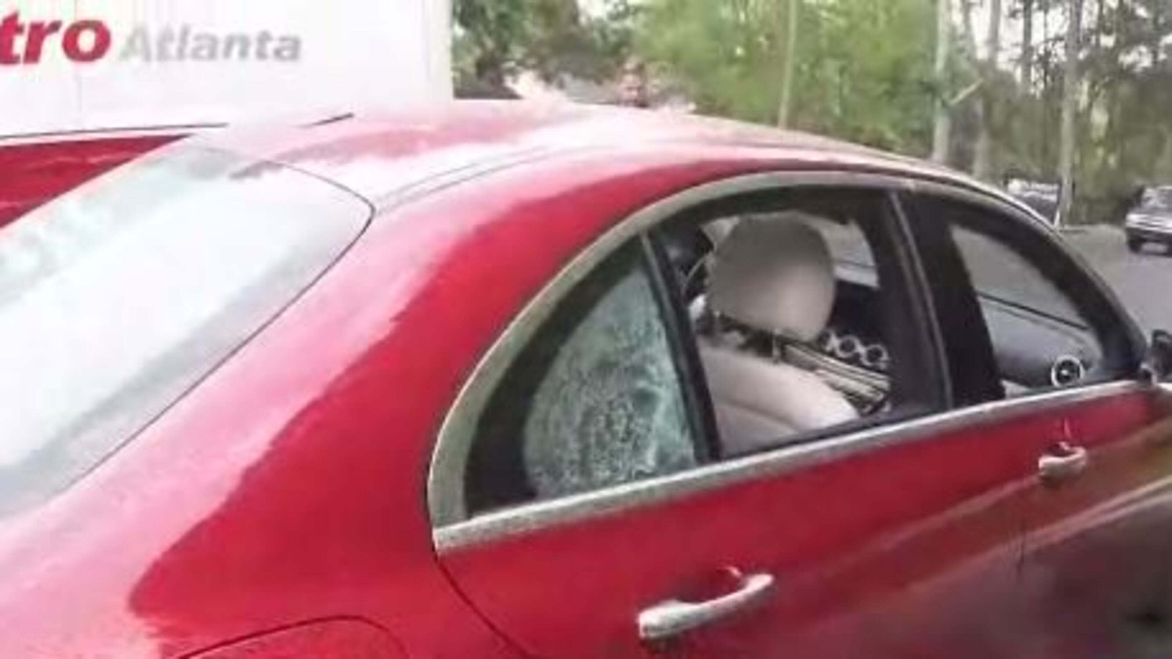 A Mercedes-Benz was struck twice by bullets Monday afternoon on Cobb Parkway in Marietta. (Credit: Channel 2 Action News)