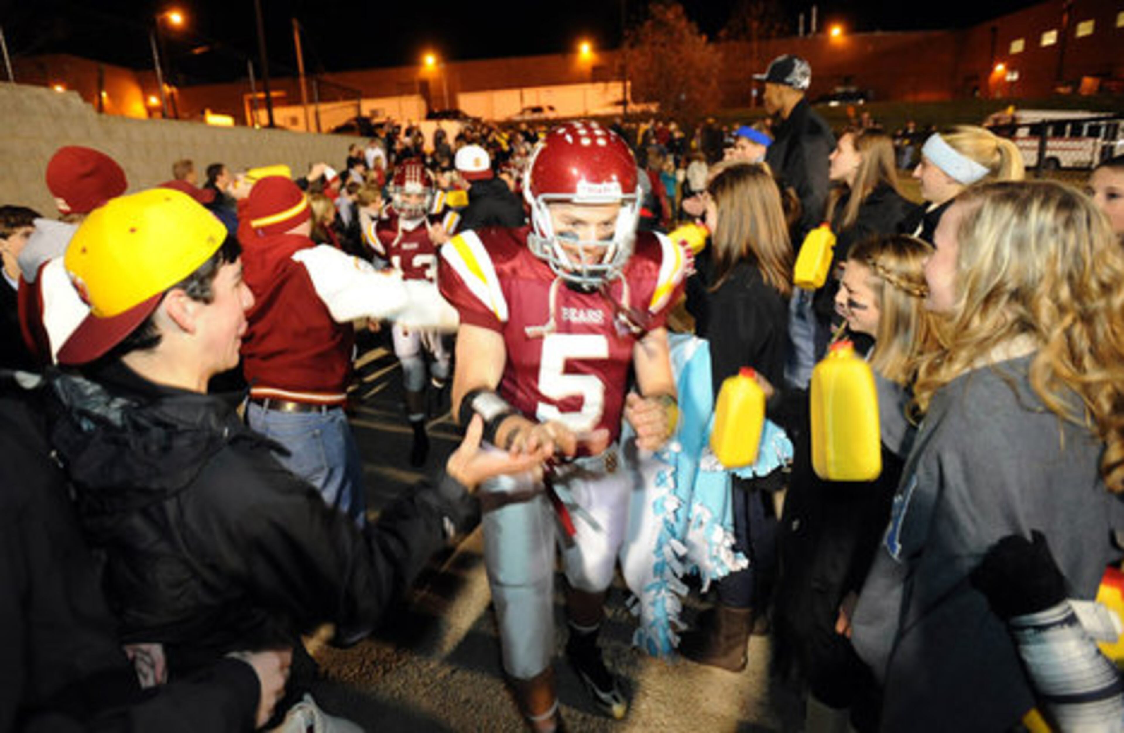 Holy Innocents fans cheer on Friday as players take the field for their state quarterfinal matchup against Clinch County in Atlanta.