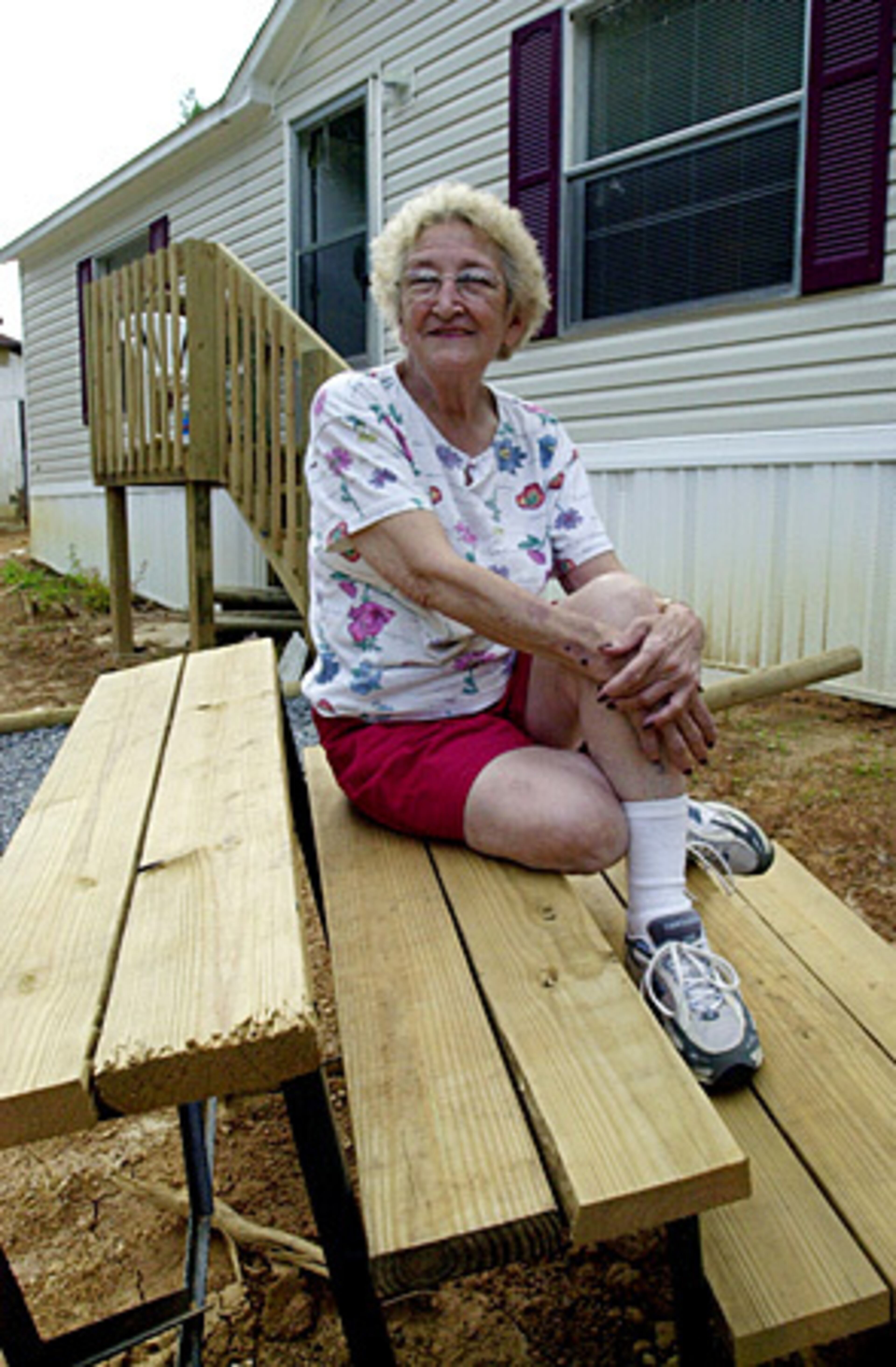 Nancy Postell, Jeffrey's mother, in front of the trailer home she shared with her son in Andrews, N.C., which is near Murphy.