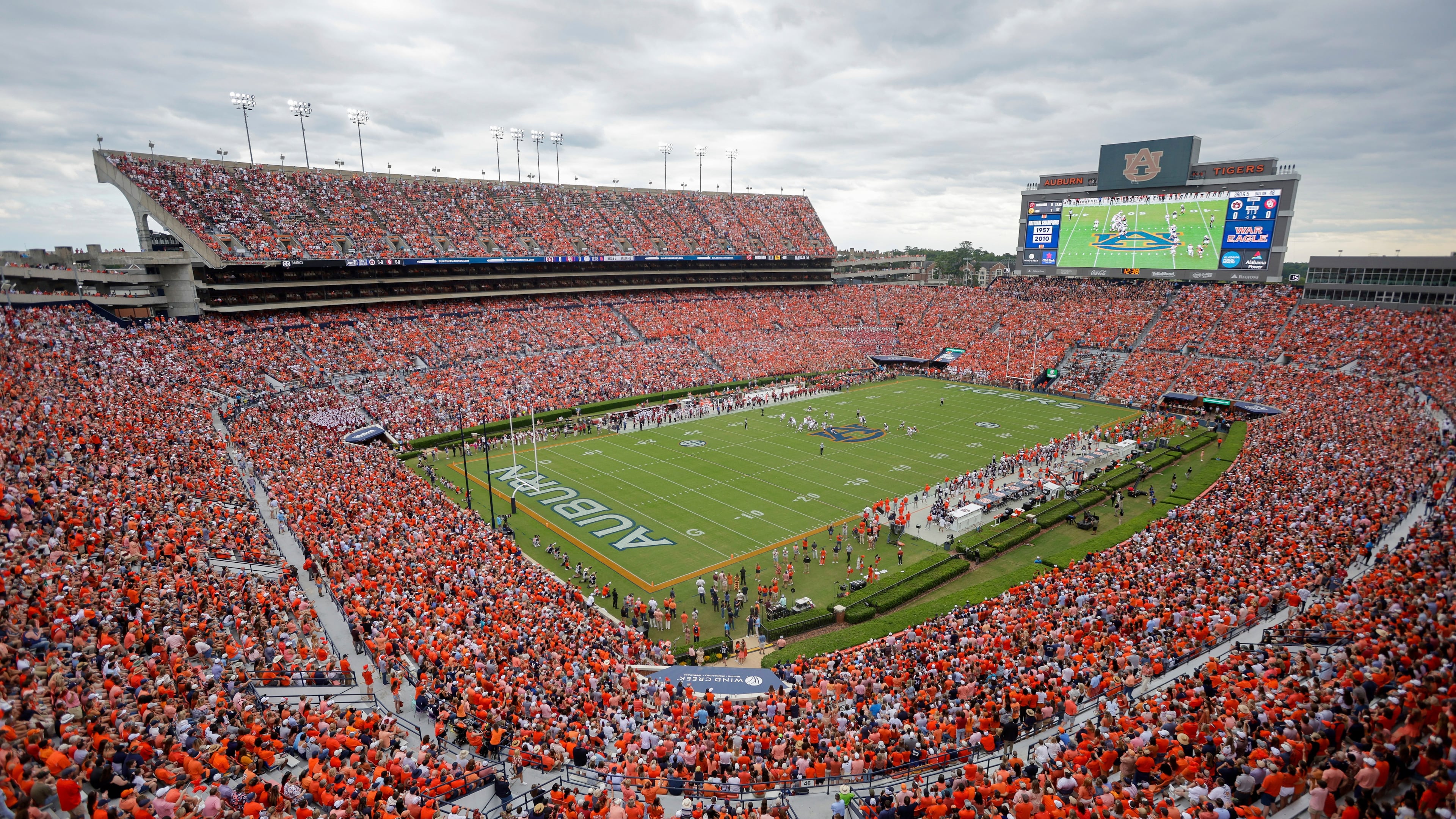FILE - Fans file Jordan-Hare Stadium during the first half an NCAA football game between the Oklahoma and Auburn, Sept. 28, 2024, in Auburn, Ala. (AP Photo/Stew Milne, File)