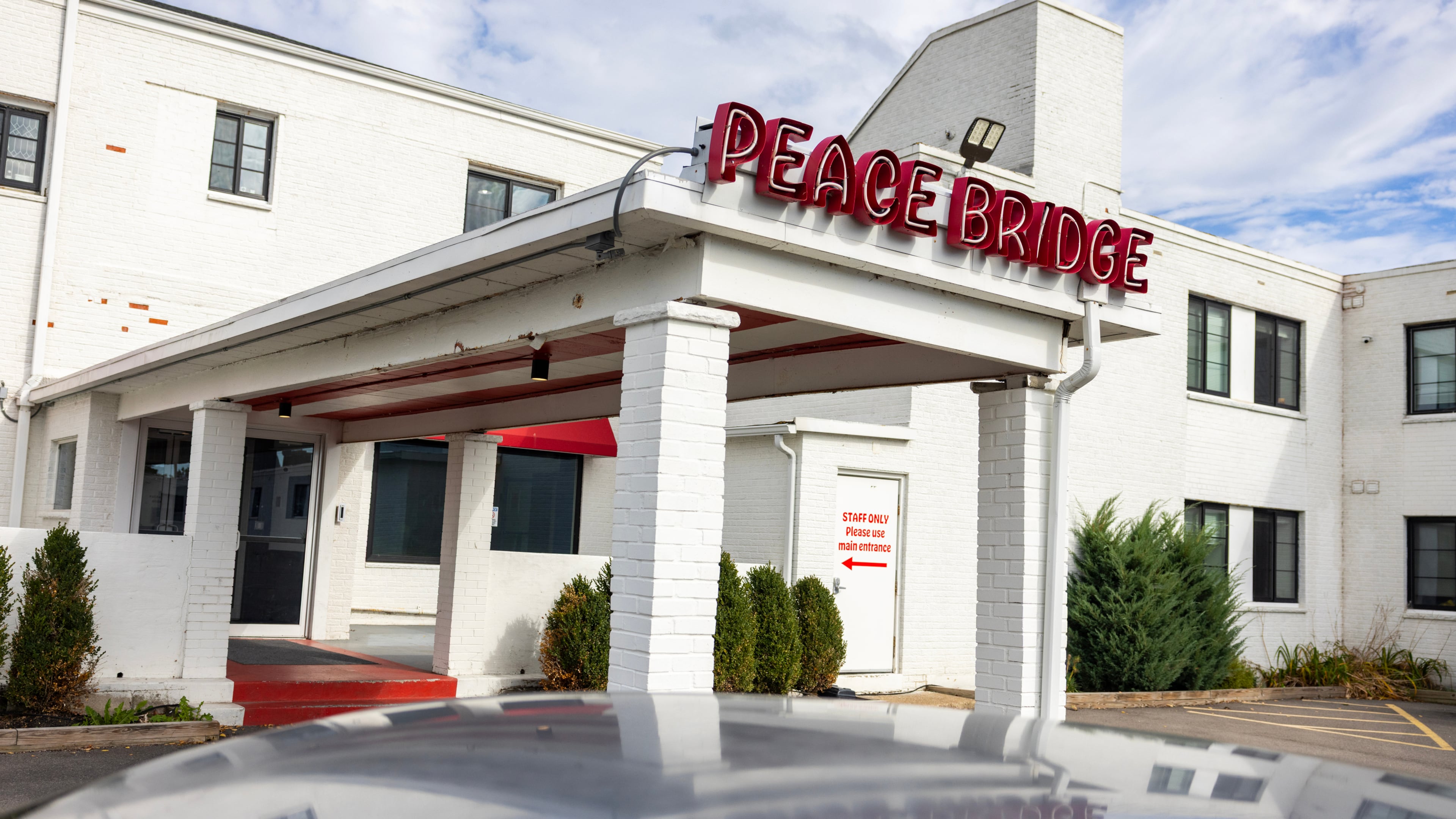 A sign is displayed for Peace Bridge Place apartments that have Viridi's lithium-ion battery energy storage system in Buffalo, N.Y., Thursday, Oct. 15, 2026. (AP Photo/Lauren Petracca)