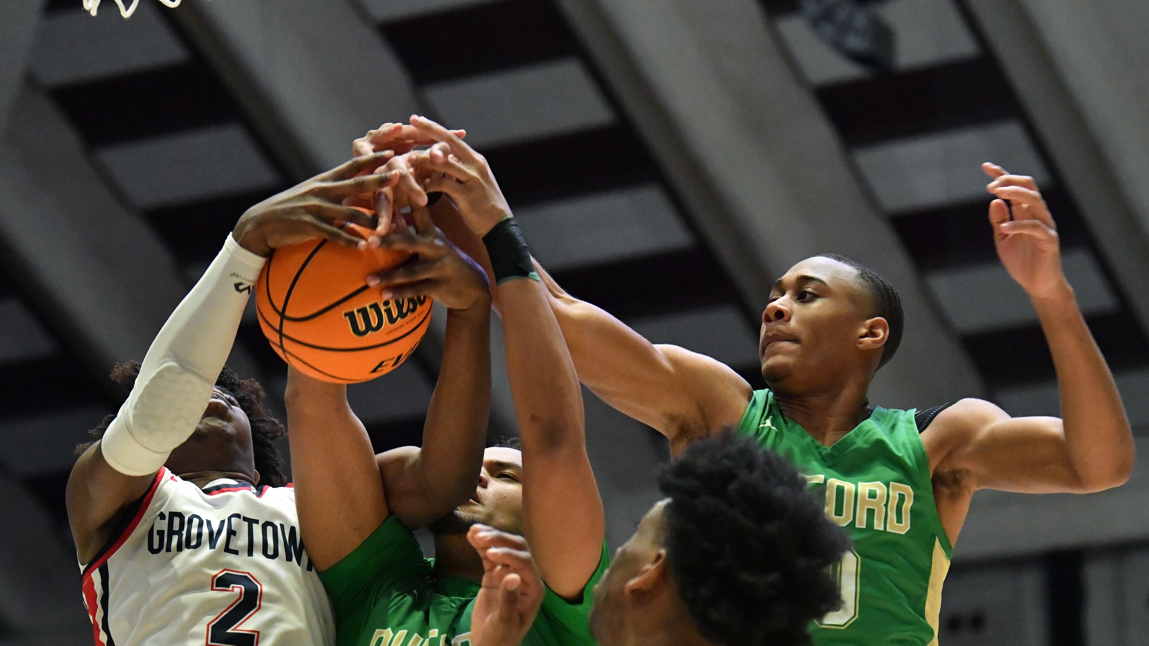 March 11, 2022 Macon - Grovetown's Frankquon Sherman (2) fights for a rebound with Buford's London Williams (23) and Buford's David Burnett (right) during the 2022 GHSA State Basketball Class AAAAAA Boys Championship game at the Macon Centreplex in Macon on Friday, March 11, 2022. (Hyosub Shin / Hyosub.Shin@ajc.com)