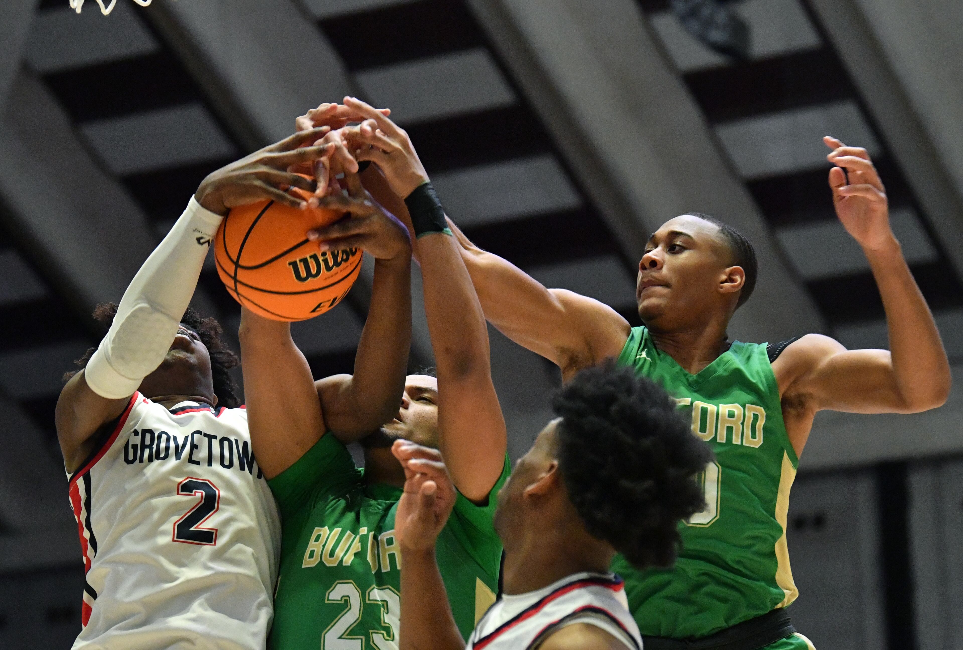 March 11, 2022 Macon - Grovetown's Frankquon Sherman (2) fights for a rebound with Buford's London Williams (23) and David Burnett (right) during the 2022 GHSA State Basketball Class AAAAAA Boys Championship game at the Macon Centreplex in Macon on Friday, March 11, 2022. (Hyosub Shin / Hyosub.Shin@ajc.com)