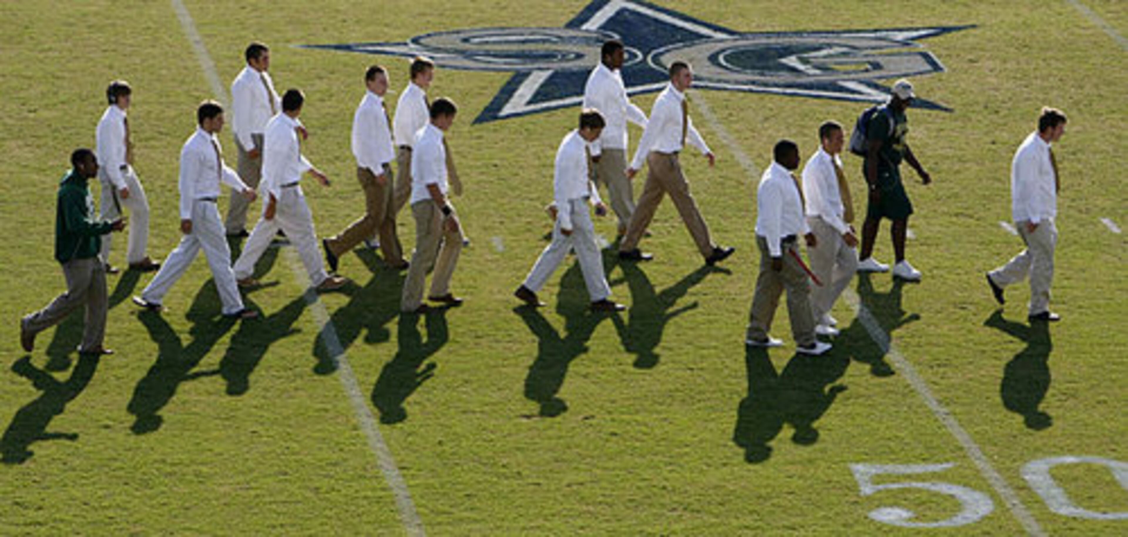 A sharp-dressed bunch of Grayson Rams head to the locker room before Friday's game against South Gwinnett.