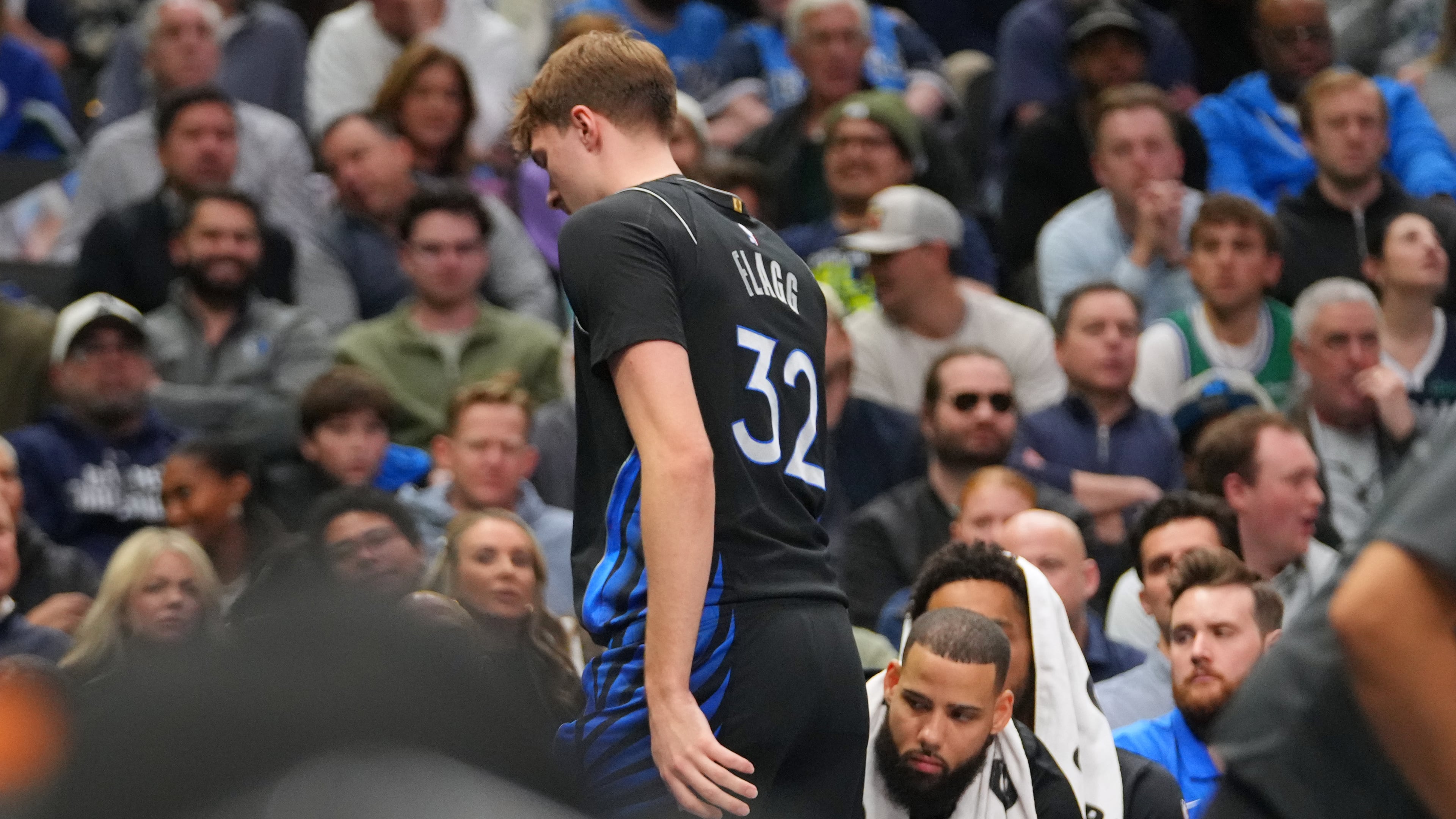 Dallas Mavericks forward Cooper Flagg leaves the court and heads to the locker room during the first half of an NBA basketball game against the Denver Nuggets Wednesday, Jan. 14, 2026, in Dallas. (AP Photo/Julio Cortez)