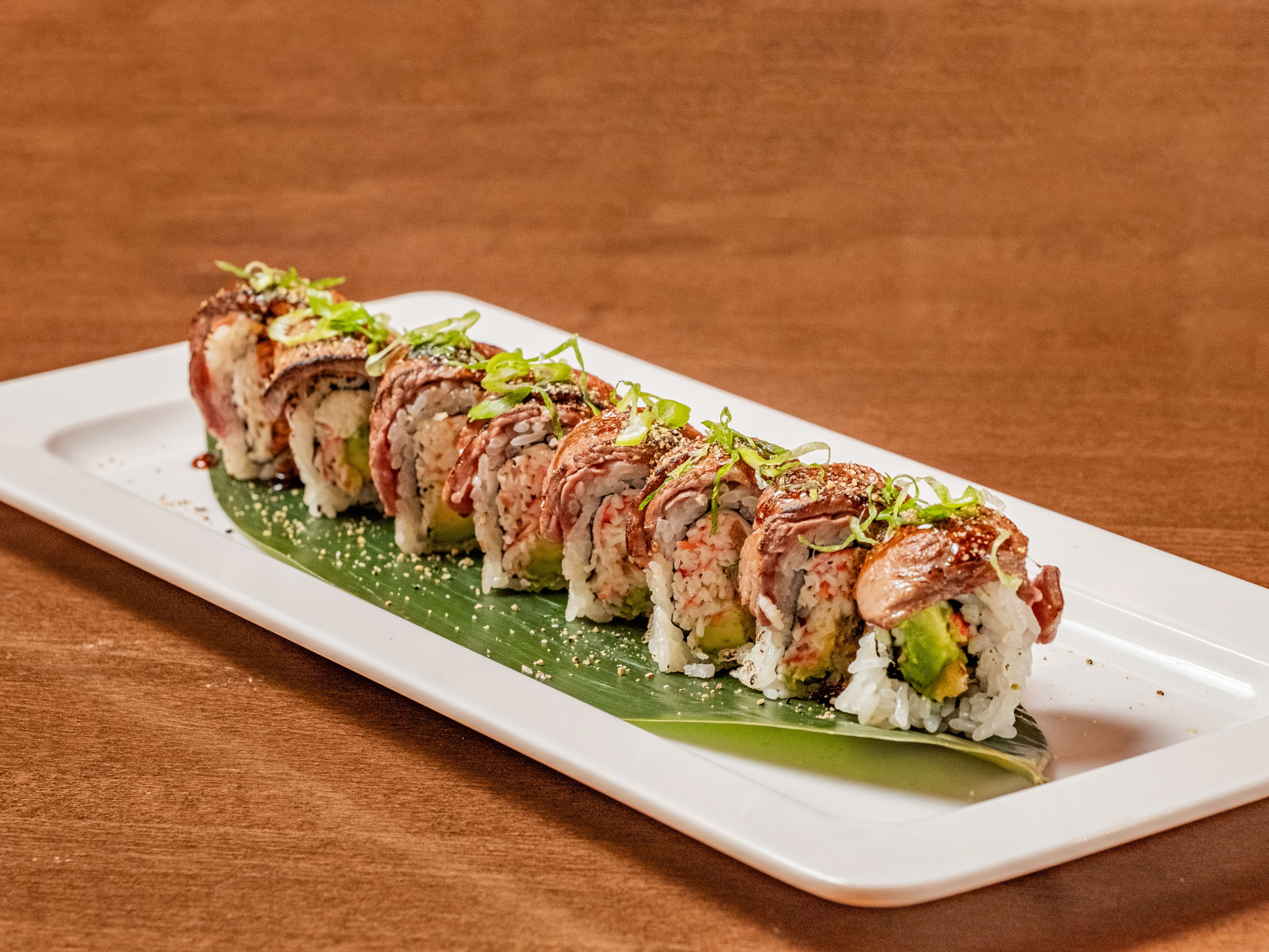 The Bobo Roll, Bobo Izakaya's signature sushi roll, is made with crabmeat, asparagus and avocado and topped with seared filet mignon. (Courtesy of Bobo Izakaya)