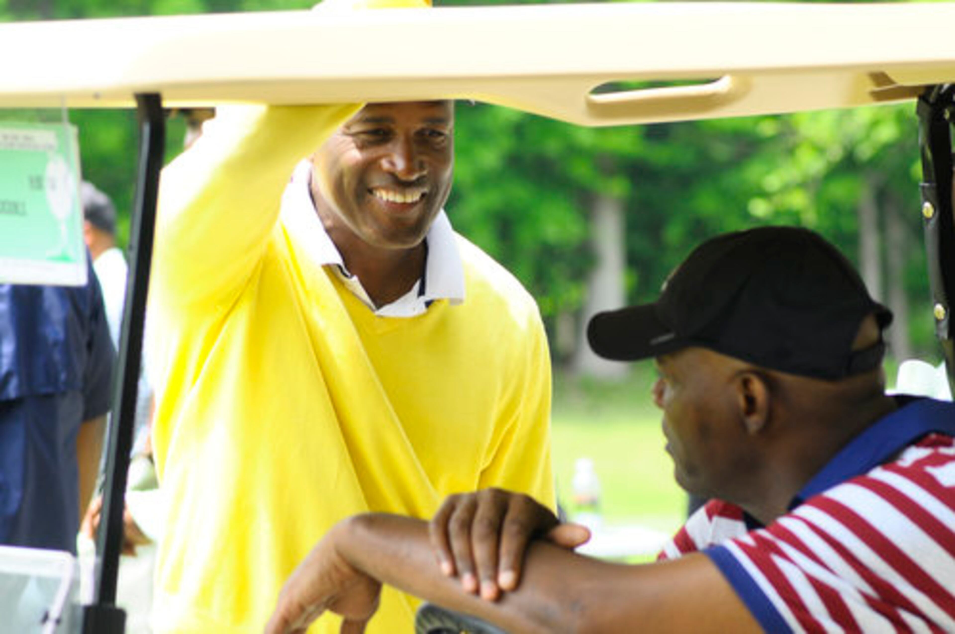 Kenny Leon takes moment in his round of golf to talk with Samuel L. Jackson. Leon recently directed Jackson in the broadway play "The Mountaintop."