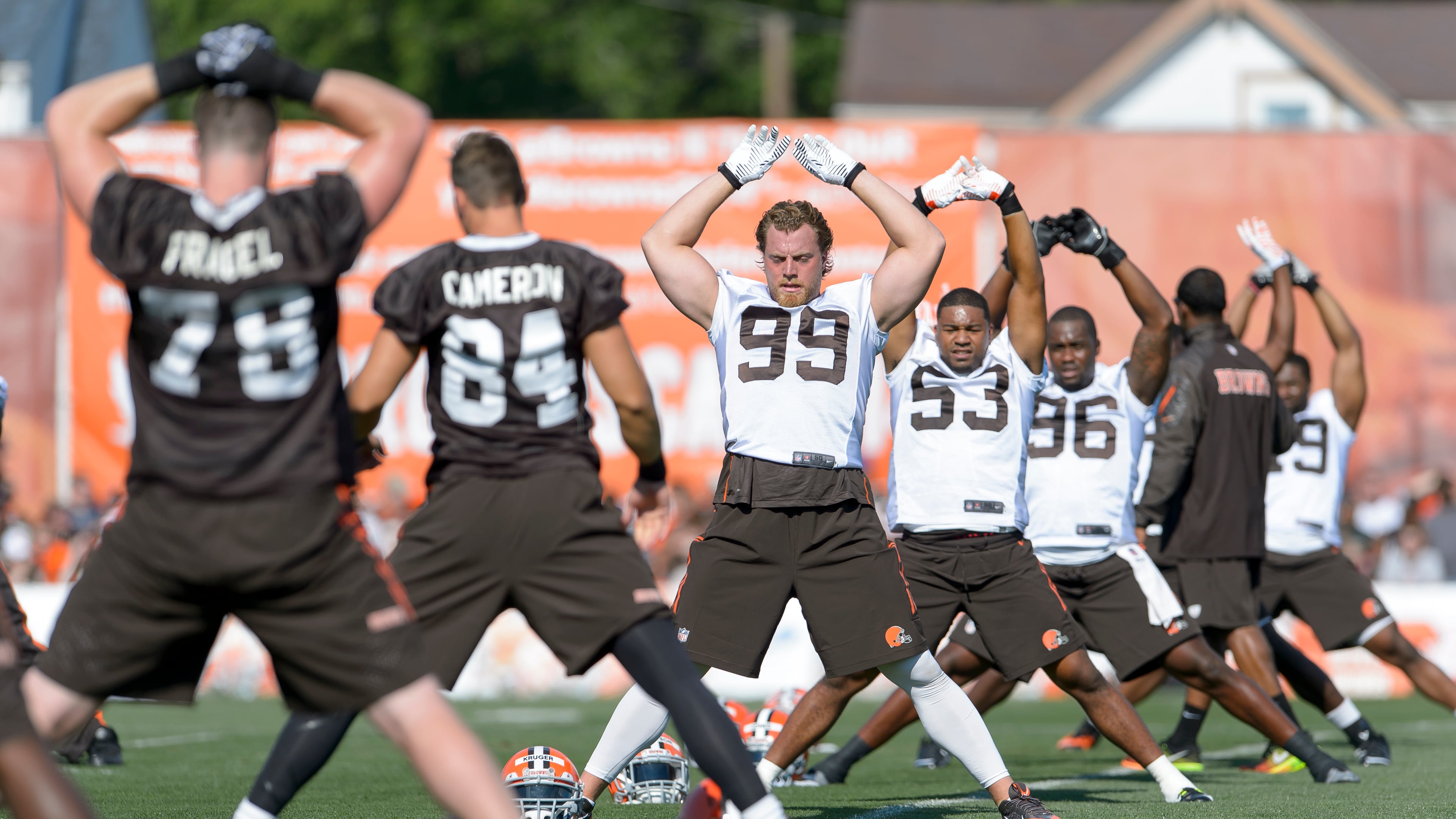 BEREA, OH - JULY 26: Cleveland Browns players stretch during training camp at the Cleveland Browns training facility on July 26, 2014 in Berea, Ohio. (Photo by Jason Miller/Getty Images)