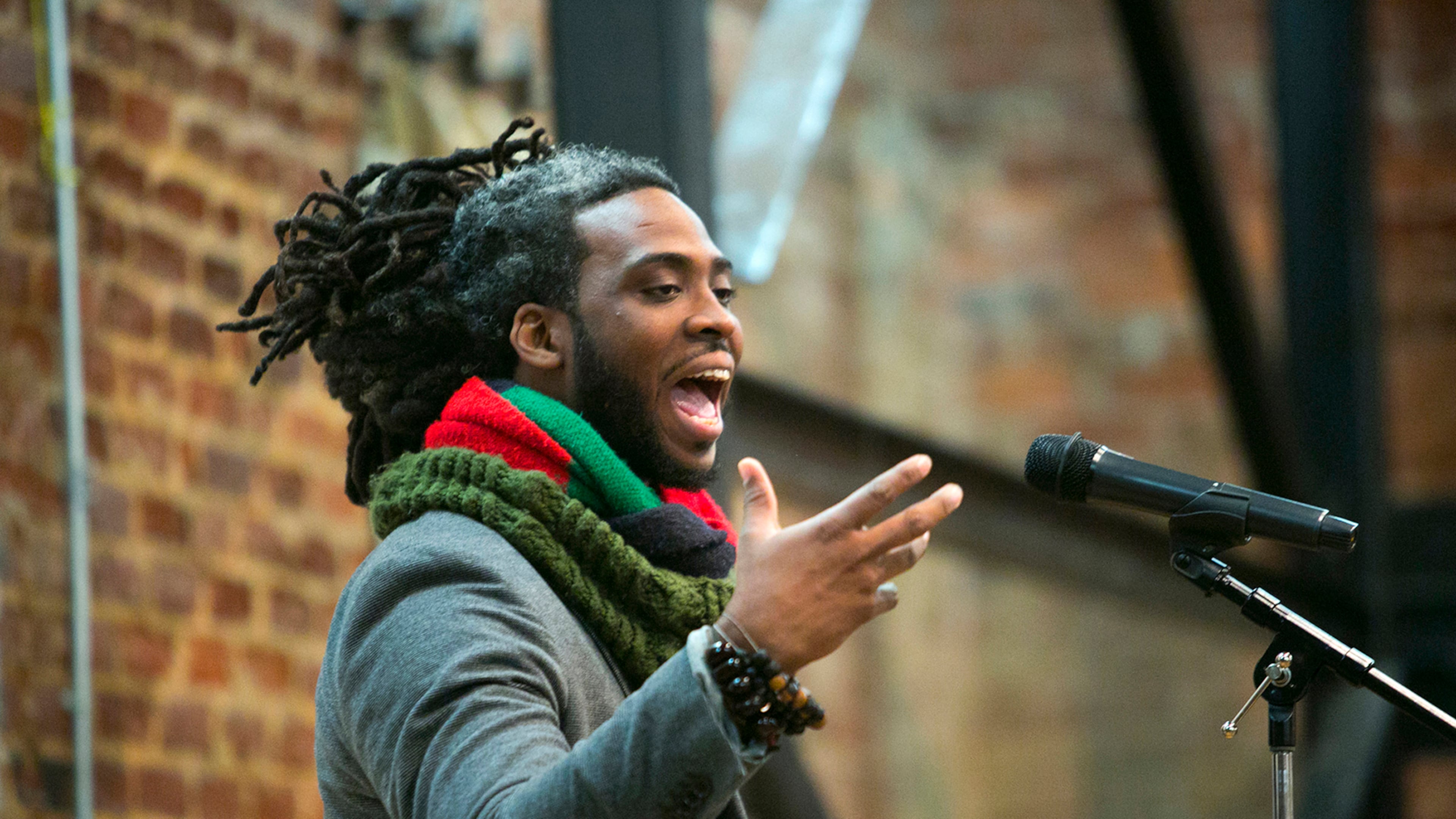 Adan Bean performs at a poetry slam at the Roswell Historic Cottage.