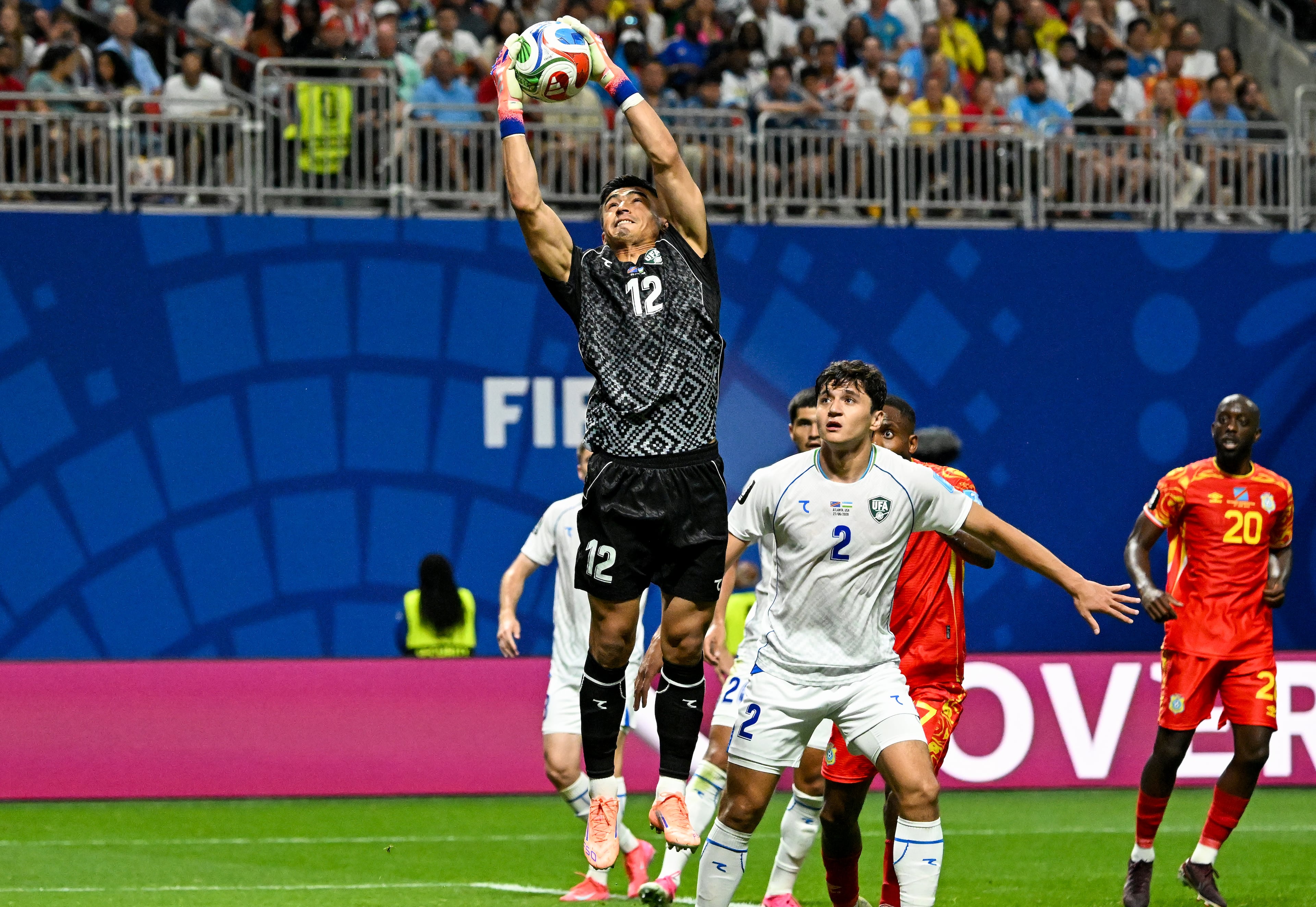 Uzbekistan goalkeeper Abduvohid Nematov (center) makes a stop against Congo during the first half of a FIFA World Cup match at Atlanta Stadium (Mercedes-Benz Stadium) on Saturday, June 27, 2026, in Atlanta. (Hyosub Shin/AJC)