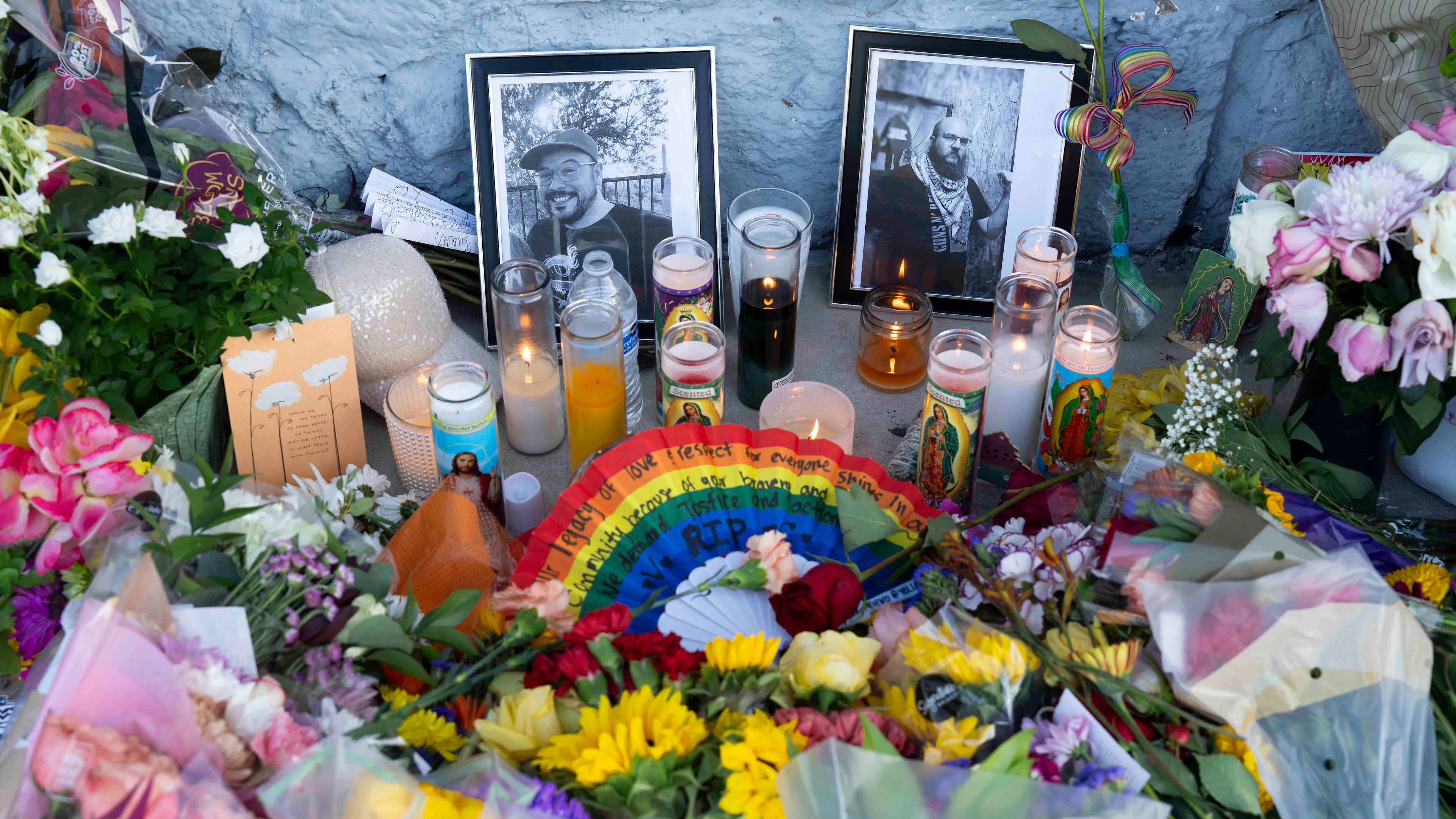 A growing memorial sits outside the Venture-N bar in Tucson, Ariz., Tuesday, Sept. 1, 2026, for Vincent Anthony Siquieros and Cameron Davis Capara, who were fatally shot in the parking lot of the gay bar shortly after midnight on Monday. (AP Photo/Rebecca Noble)