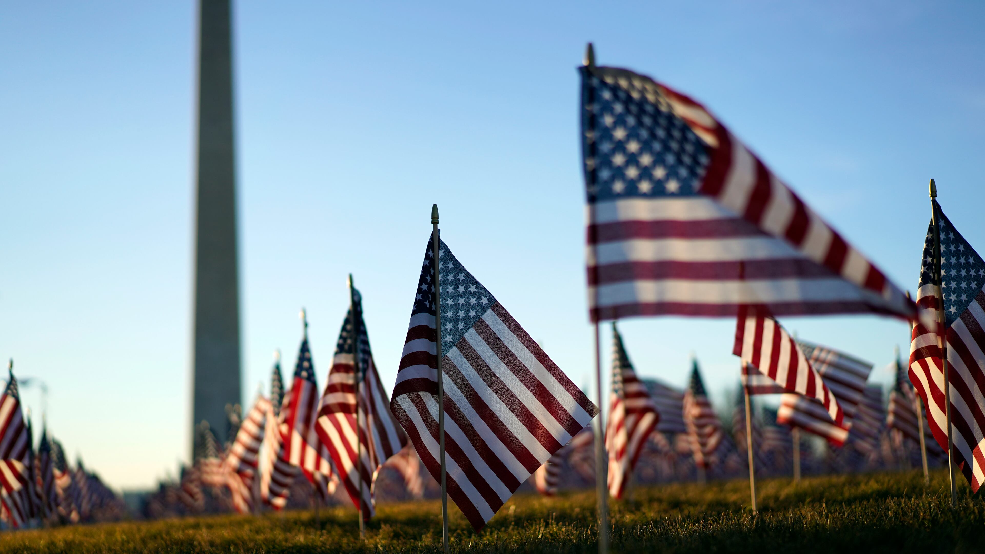 Flags line the National Mall, with the Washington Monument behind them, ahead of the inauguration of President-elect Joe Biden and Vice President-elect Kamala Harris on Tuesday, Jan. 19, 2021, in Washington , DC. (Kent Nishimura/Los Angeles Times/TNS)
