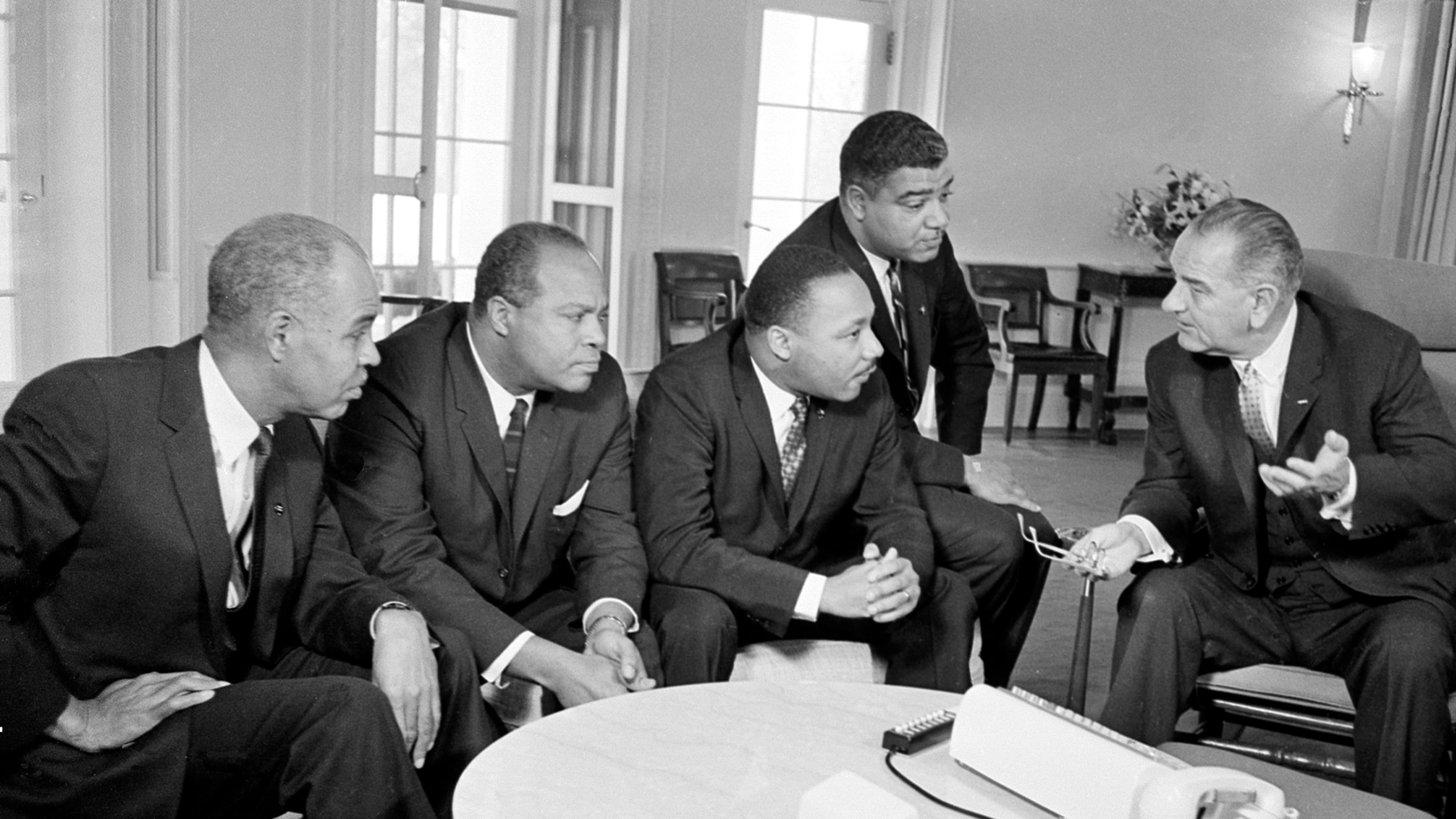 U.S. President Lyndon B. Johnson, right, talks with civil rights leaders in his White House office in Washington, D.C., Jan. 18, 1964. The Black leaders, from left, are Roy Wilkins, executive secretary of the NAACP; James Farmer, national director of the Committee on Racial Equality; the Rev. Martin Luther King Jr., head of the Southern Christian Leadership Conference; and Whitney Young, executive director of the Urban League. (AP file photo)