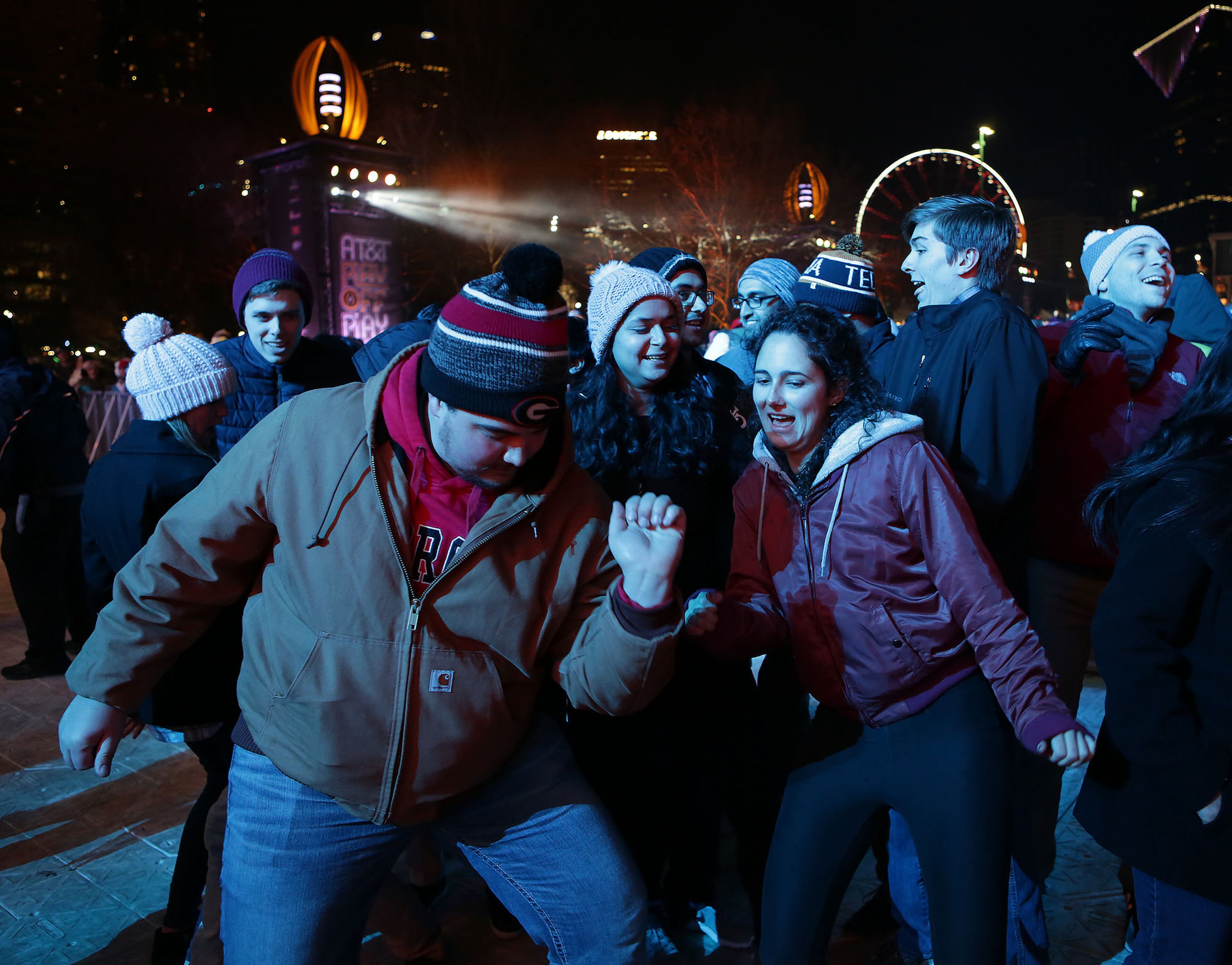 January 7, 2018 - ATLANTA: Enthusiastic Georgia fans, Bryan Patrick, left and Andi Otto dancing to the music of Spencer Ludwing at the AT&T Playoff Playlist Live! concert series pre-game celebrations at Centennial Olympic Park on Sunday, January 7, 2018. (Akili-Casundria Ramsess/Eye of Ramsess Media)