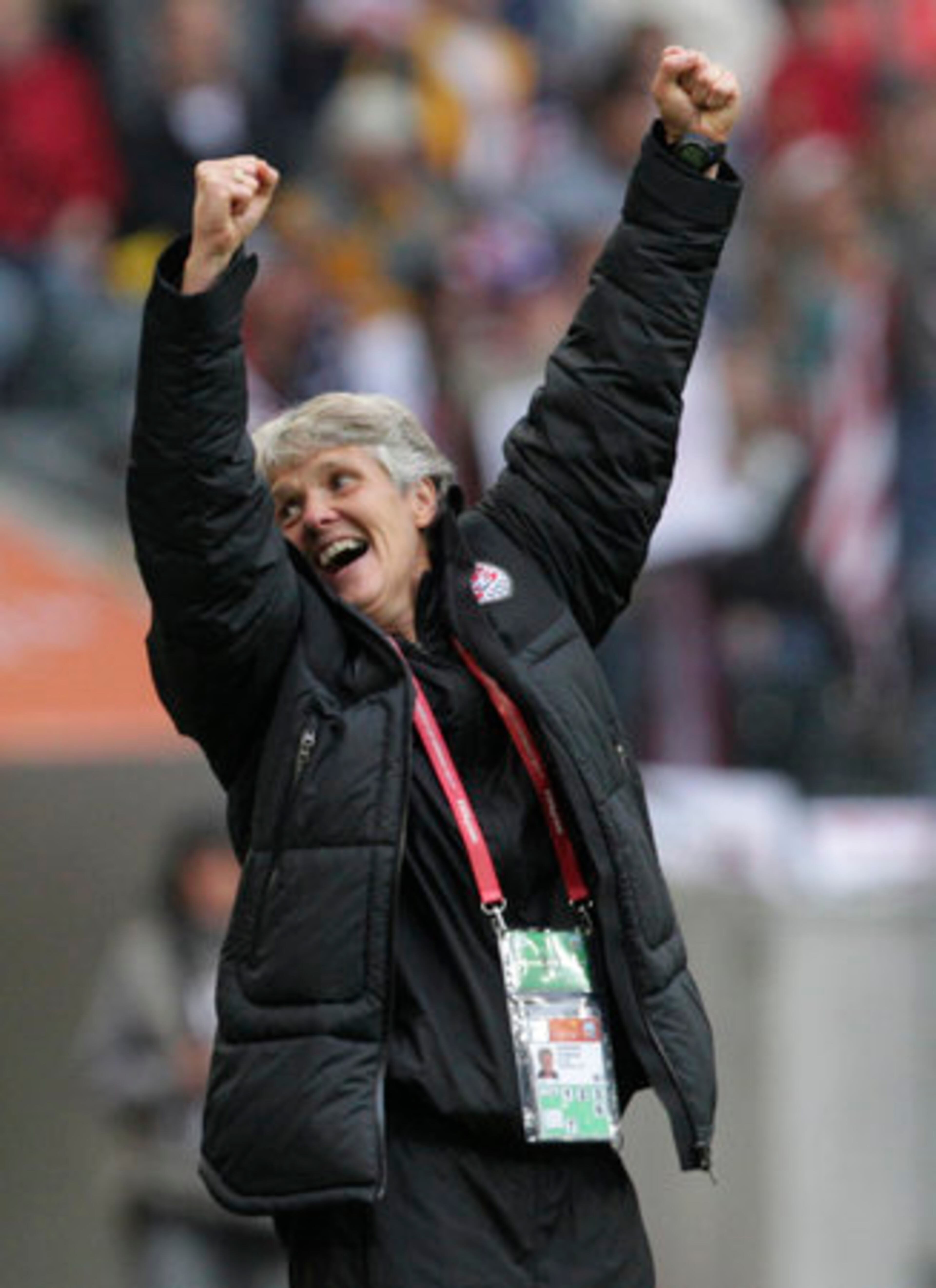 U.S. coach Pia Sundhage throws her arms in the air after injury time expires. She had high praise for Abby Wambach. "Abby, she's just the best. I'm very happy to have her on our team. Great."