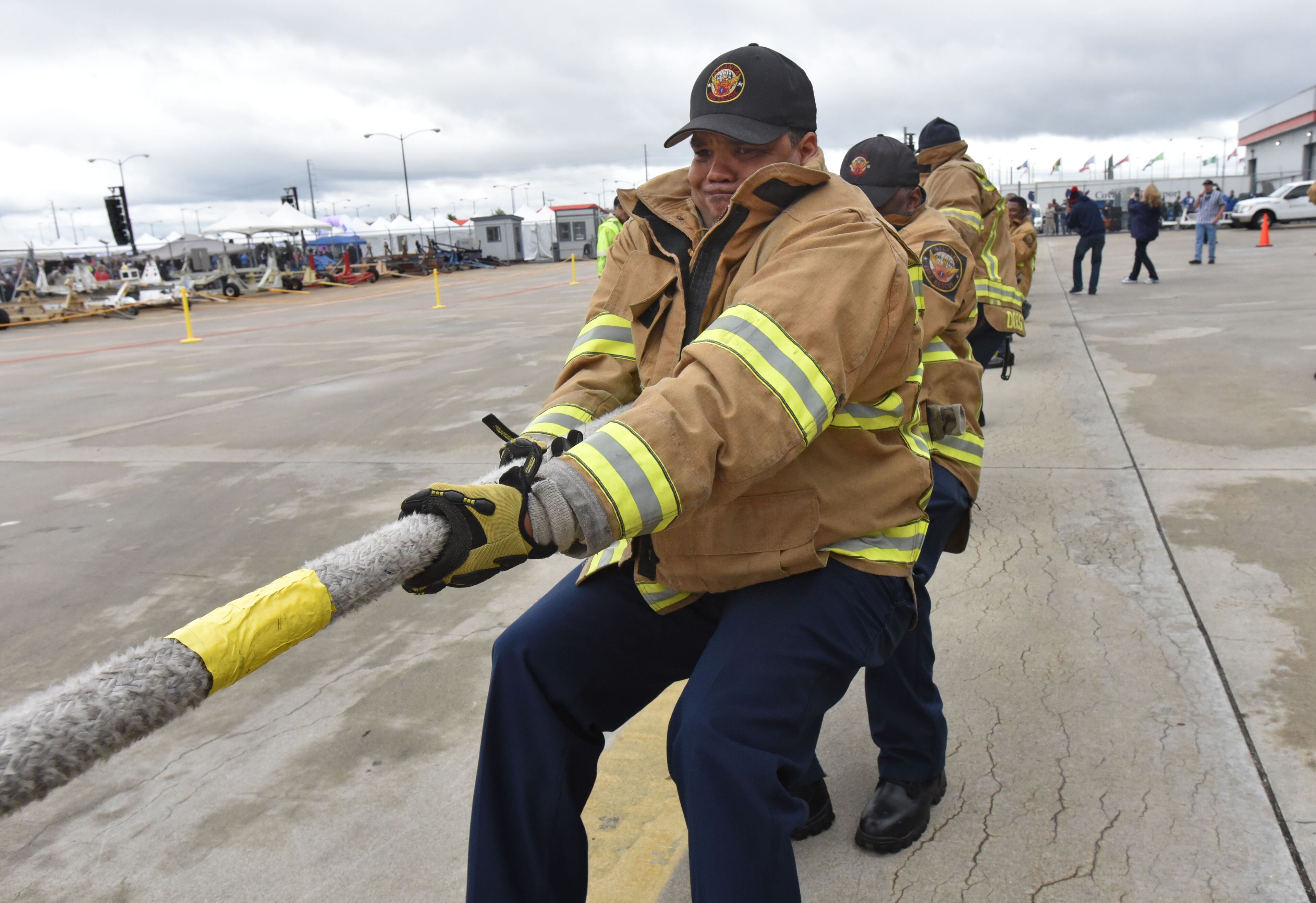 May 5, 2017 Atlanta - Firefighters from Atlanta Fire Department's Airport Division participate in the Delta Jet Drag on Friday, May 5, 2017. Teams, of no more than 20 people are timed as they compete for prizes as they pull a 167,000-pound pound Boeing 757 aircraft for about 20 feet. When the Delta Jet Drag began eight years ago, Robert Cisneros signed up to pull that 167,000 pound plane. At first, participating in the fundraiser was just a way to support friends, coworkers and loved ones battling cancer. Then, when his mother was diagnosed, that passion turned into something more. HYOSUB SHIN / HSHIN@AJC.COM