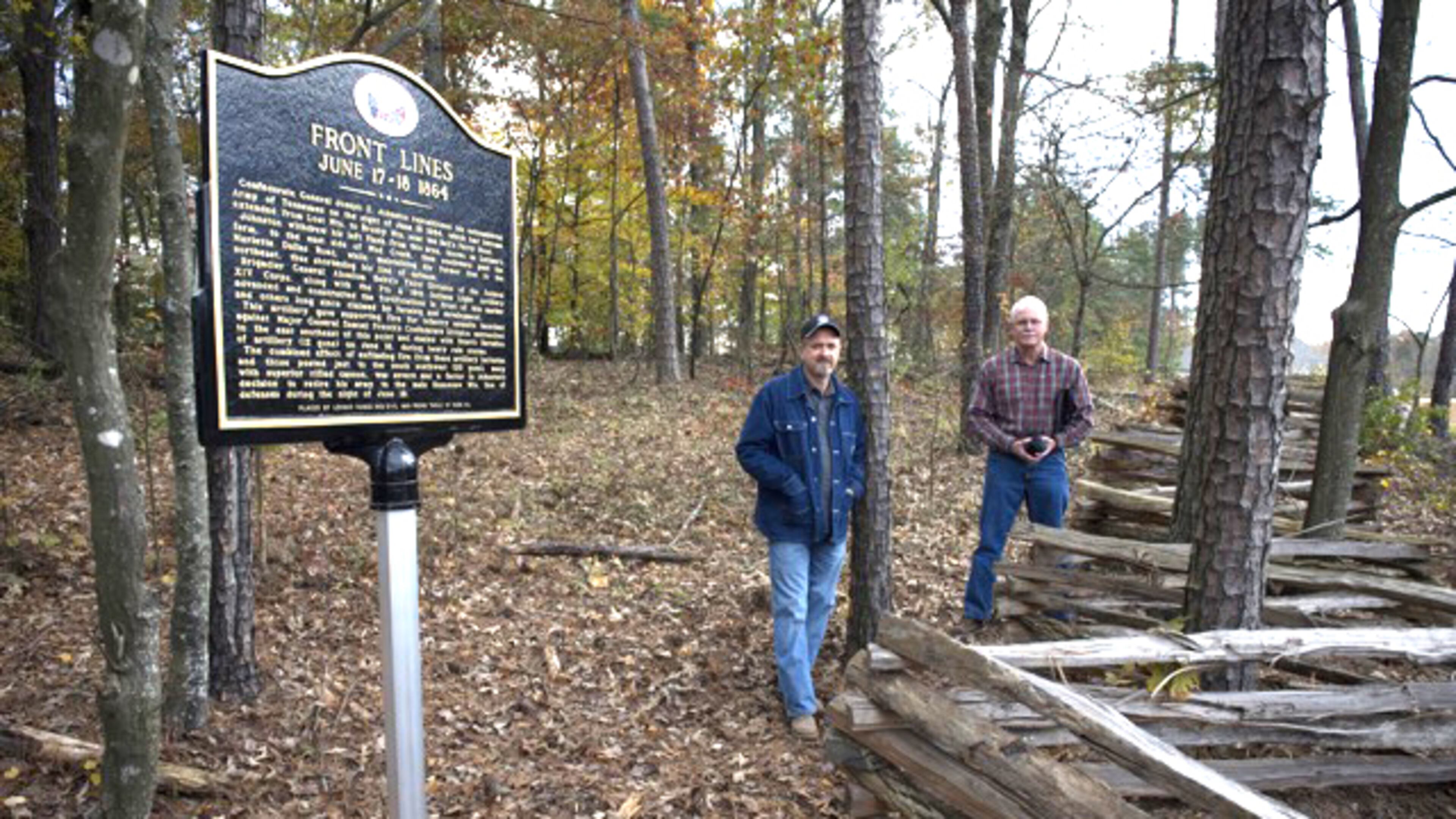 Jeff Wright (left) and William Lathem at a preserved Civil War site in Cobb County marking the June 1864 battle line between Federal and Confederate forces. JEFF WRIGHT PHOTO