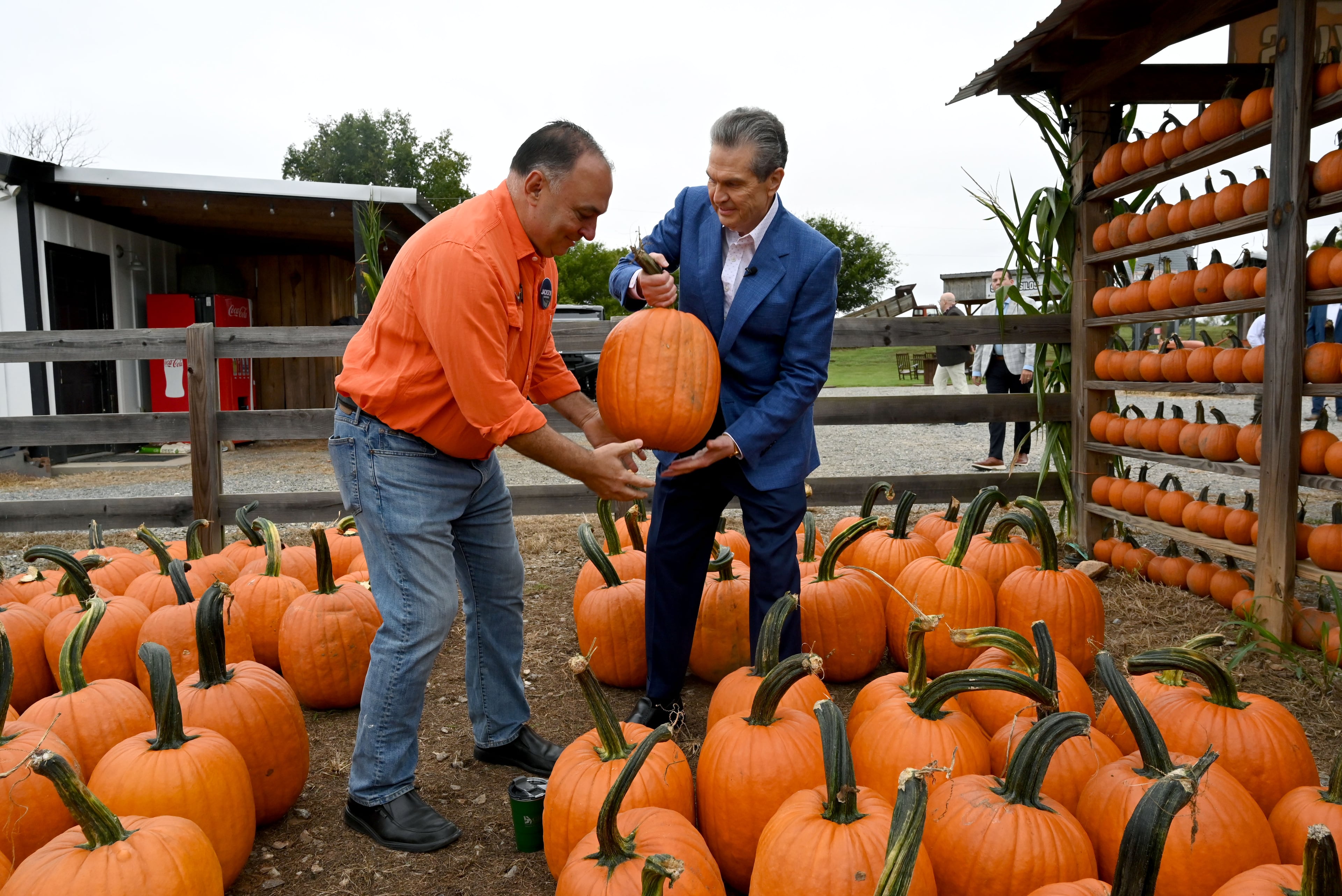 Georgia Republican nominee for governor Rick Jackson (right) and Georgia State Rep. Brent Cox hold a pumpkin during an event in Canton last week. (Hyosub Shin/AJC)