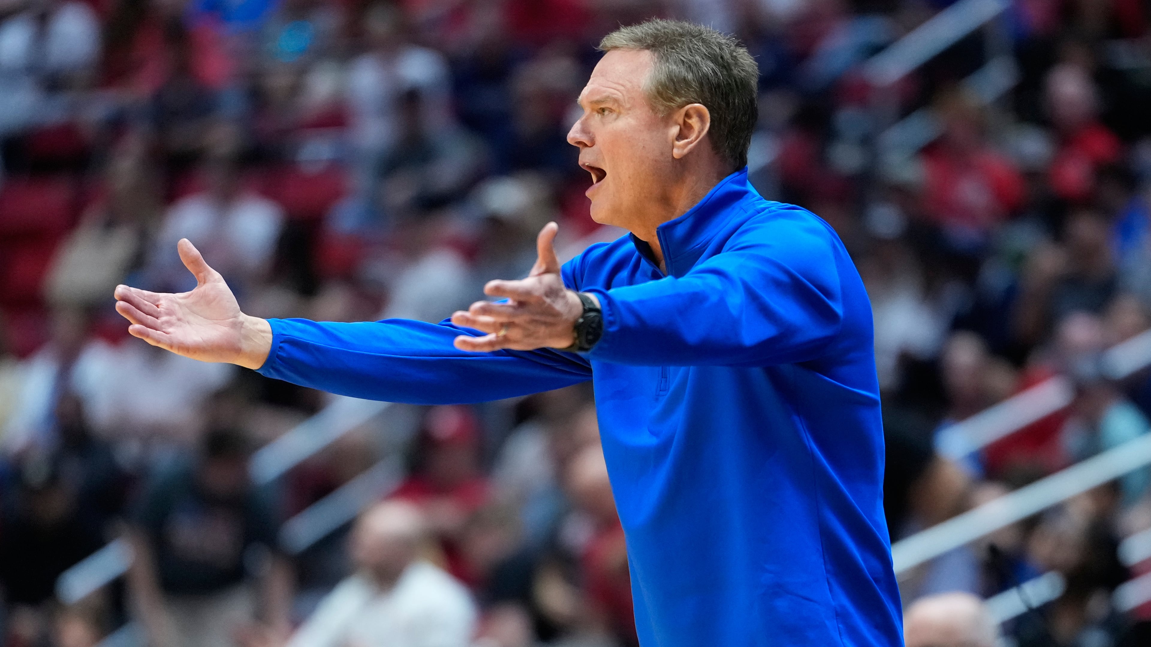 FILE - Kansas head coach Bill Self motions towards the court during the first half of a game between Kansas and St. John's in the second round of the NCAA college basketball tournament Sunday, March 22, 2026, in San Diego. (AP Photo/Mark J. Terrill, File)