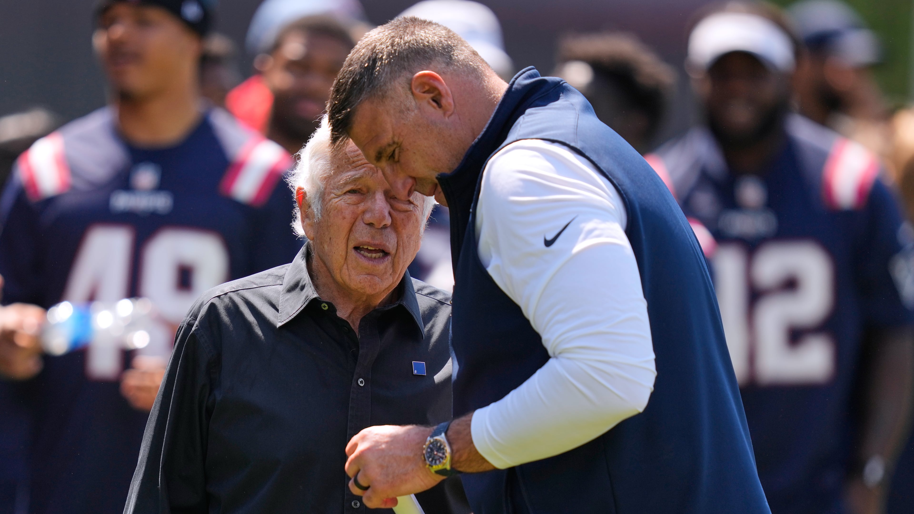 New England Patriots owner Robert Kraft talks with head coach Mike Vrabel during a community NFL football day, Wednesday, May 20, 2026, in Foxborough, Mass. (AP Photo/Charles Krupa)