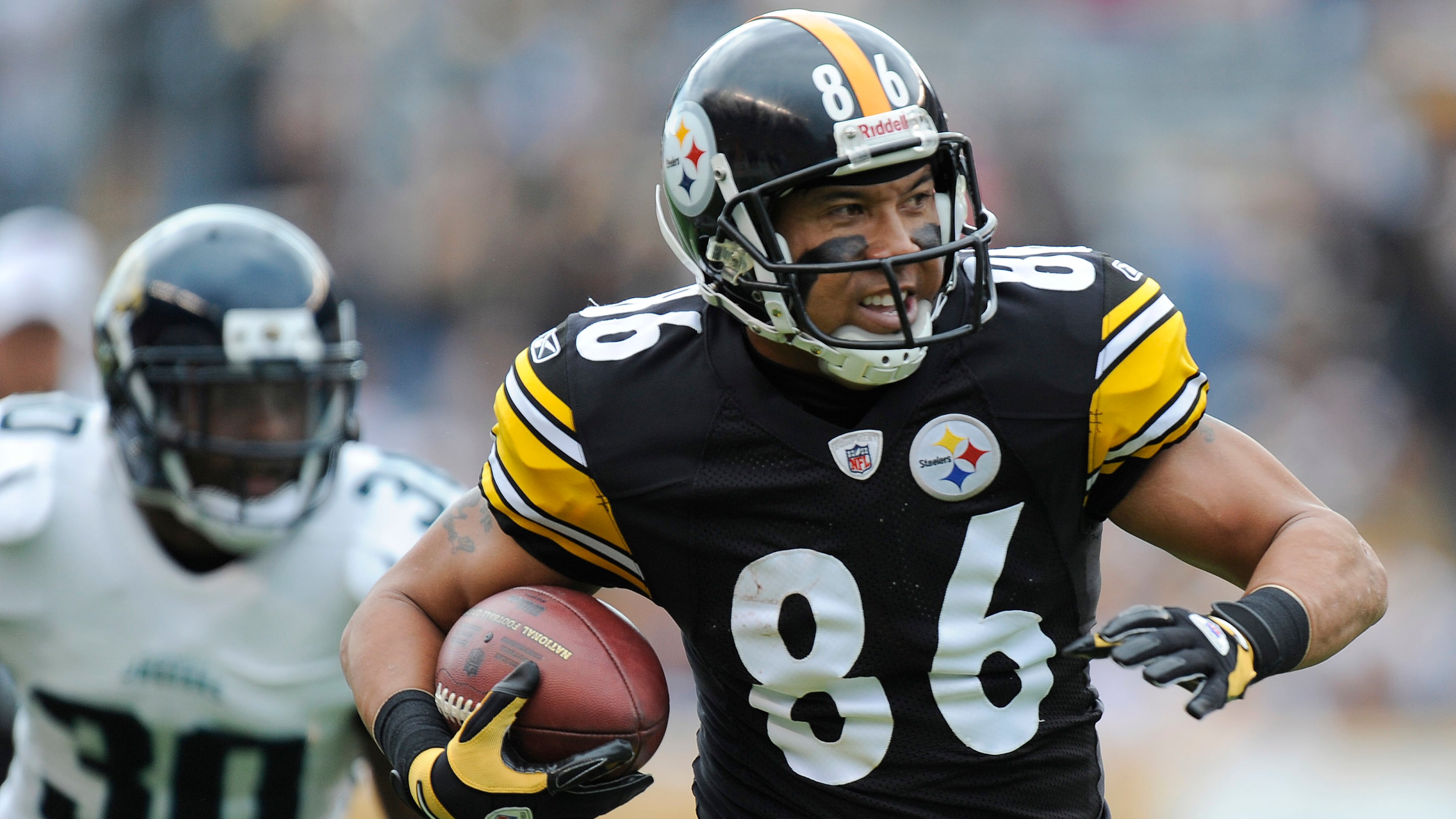 In this Sunday, Oct. 16, 2011, file photo, Pittsburgh Steelers wide receiver Hines Ward (86) runs past Jacksonville Jaguars defensive back Drew Coleman (30) after making a catch in the second quarter of an NFL football game in Pittsburgh. Ward's 12,083 receiving yards are the most in NFL history by a former Georgia high school player. Ward was a multi-posiiton player at Forest Park in the 1990s. (Don Wright/AP File)