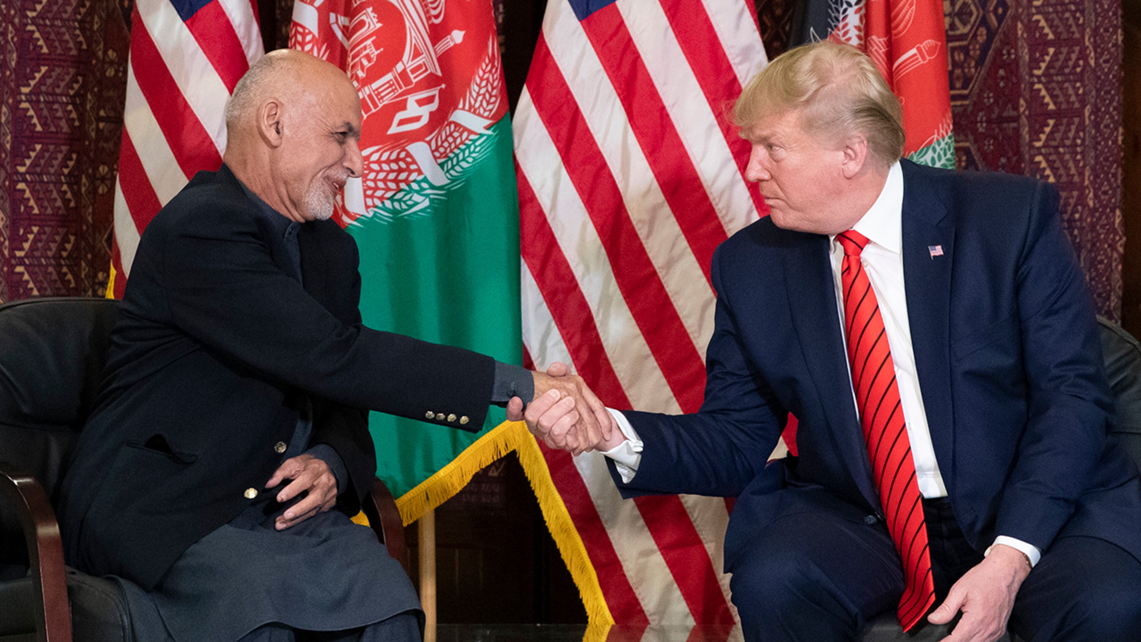 President Donald Trump shakes hands during a meeting with Afghan President Ashraf Ghani during a surprise Thanksgiving Day visit, Thursday, Nov. 28, 2019, at Bagram Air Field, Afghanistan. (AP Photo/Alex Brandon)