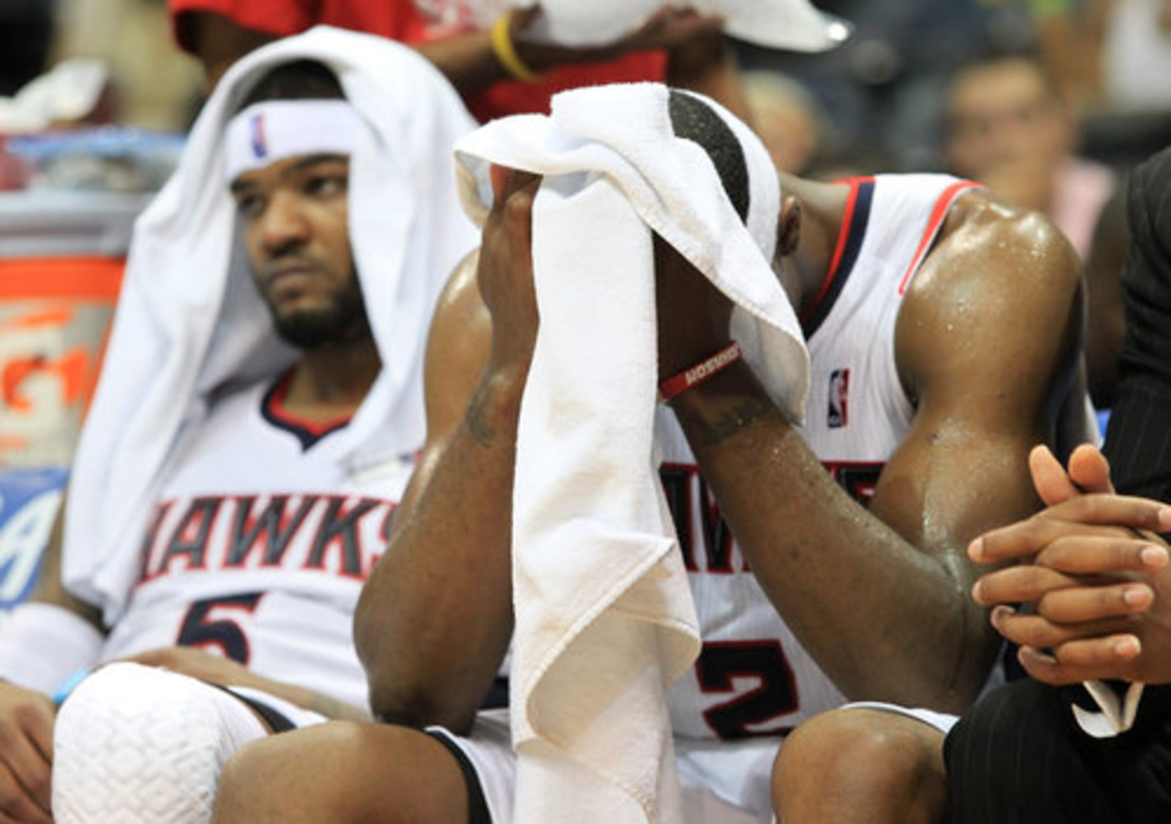 Josh Smith (left) and Joe Johnson sit on the sideline during the final minutes of Thursday's 93-73 loss to the Chicago Bulls in the Eastern Conference semifinals.
