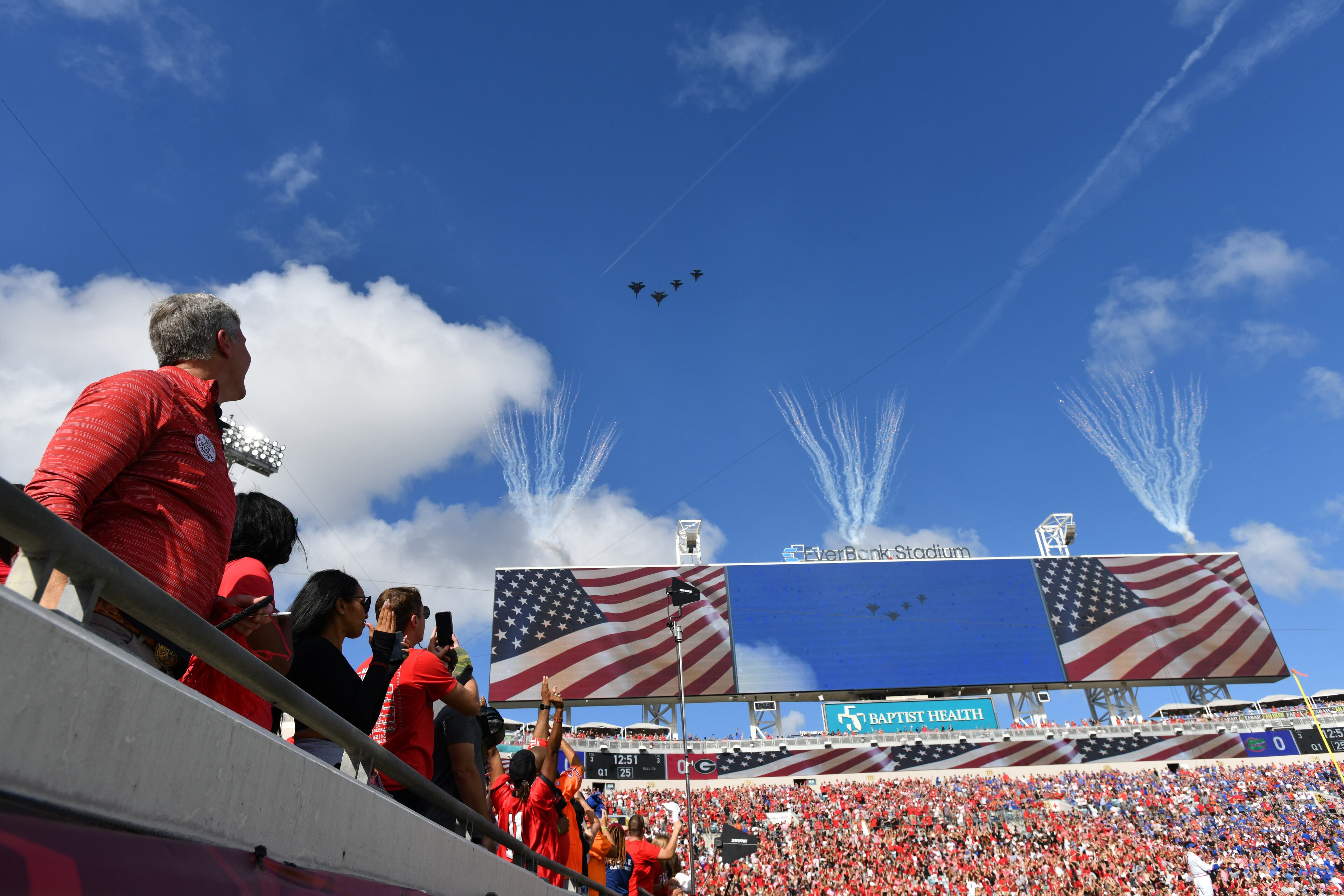 Football fans watch the flyover before the NCAA football game at EverBank Stadium, Saturday, November 2, 2024, in Jacksonville, Fla. Georgia won 34-20 over Florida. (Hyosub Shin / AJC)