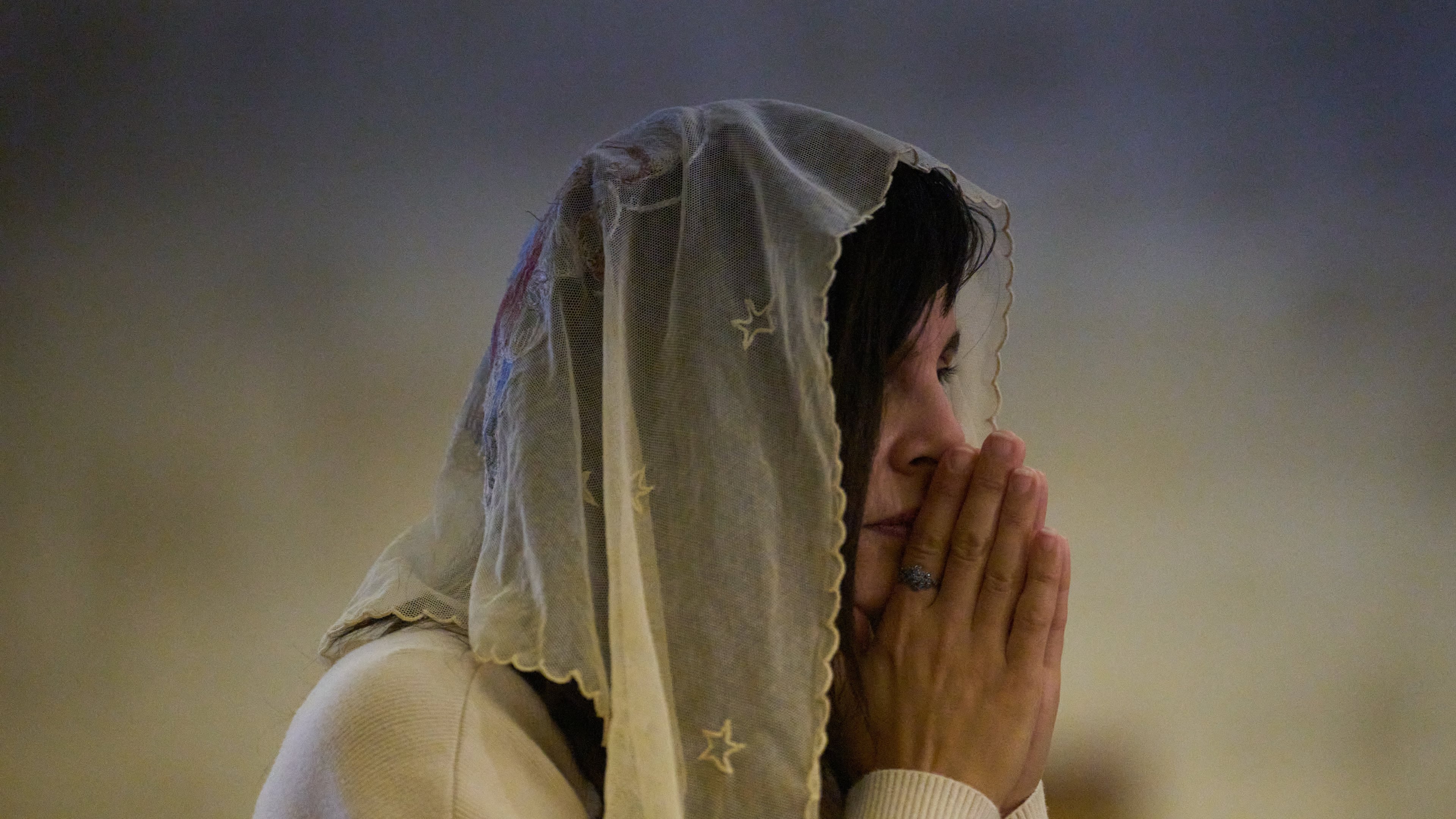 A Christian pilgrim attends a Mass in the Basilica of the Transfiguration on Mount Tabor, northern Israel, Aug. 6, 2026. (AP Photo/Ariel Schalit)