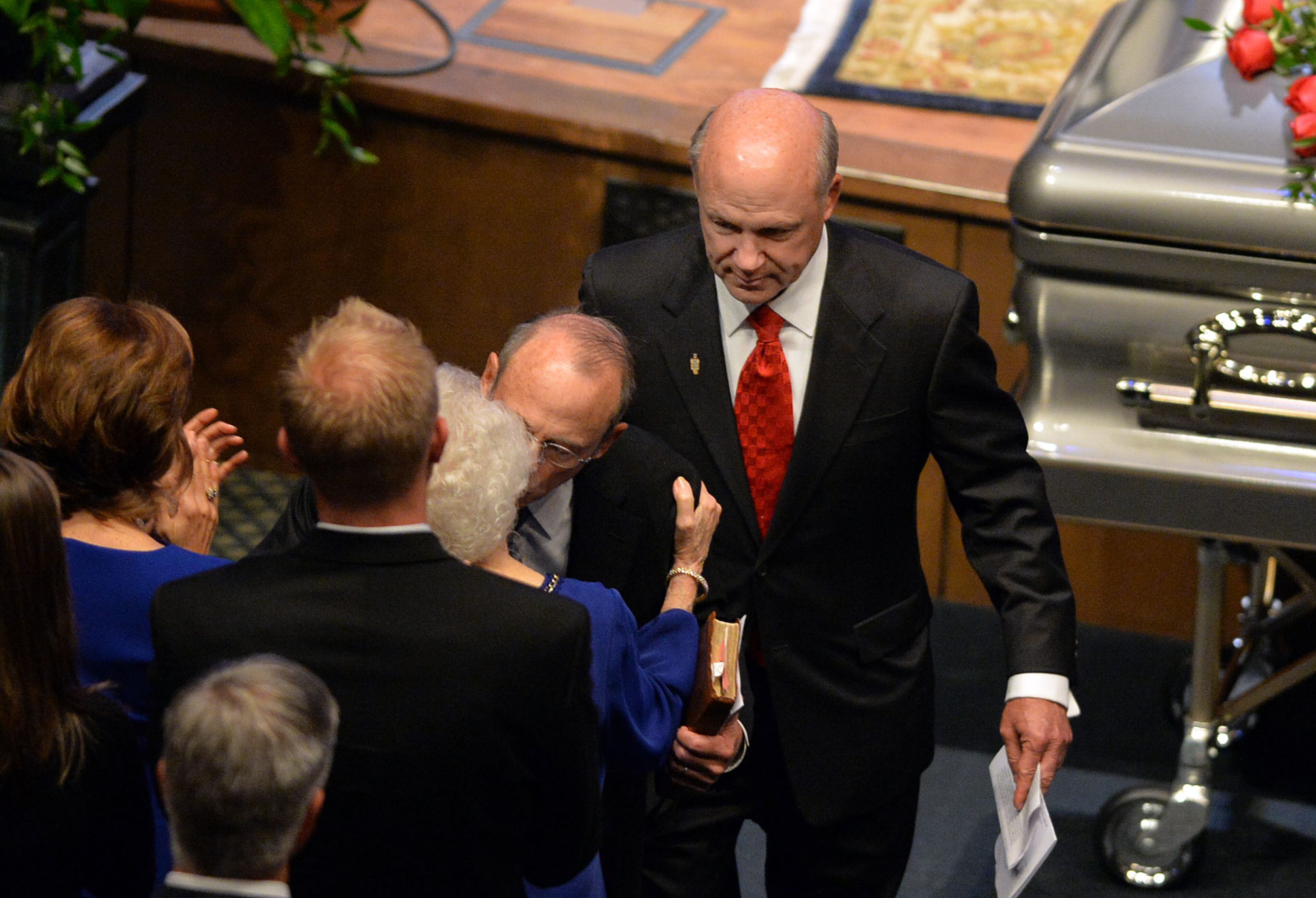 Donald "Bubba" Cathy (left) and Dan Cathy give hugs to their sister Trudy, and mother, Jeannette after giving family remarks during the service for Chick-fil-A founder Truett Cathy at the First Baptist Church, Jonesboro, GA, Wednesday September 10, 2014.