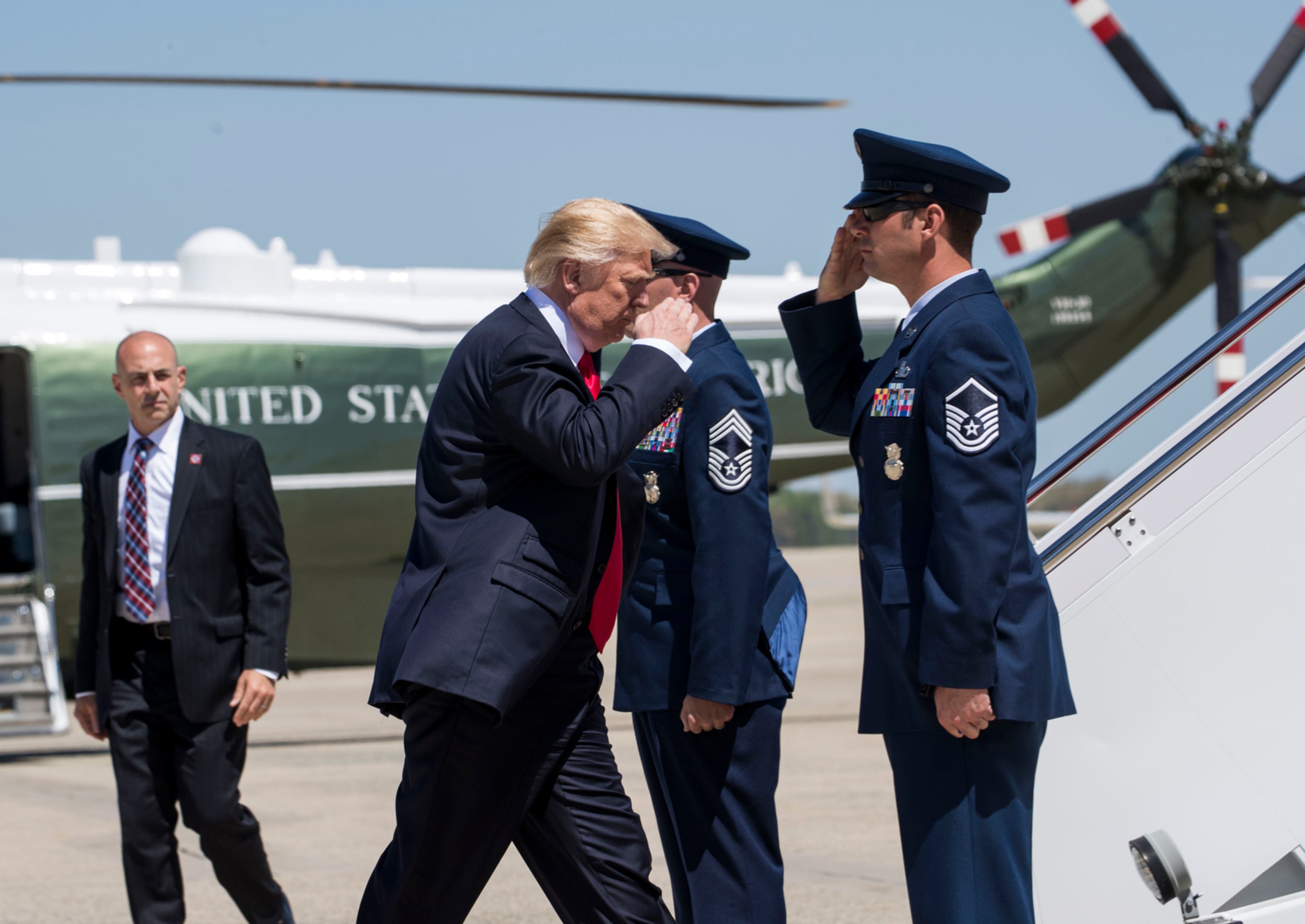 President Donald Trump boards Air Force One for a trip to Wisconsin, at Joint Base Andrews in Maryland, April 18, 2017. Trump is slated to tour the Snap-On tool company and sign the ?Buy American, Hire American" executive order in Kenosha on Tuesday. (Doug Mills/The New York Times)