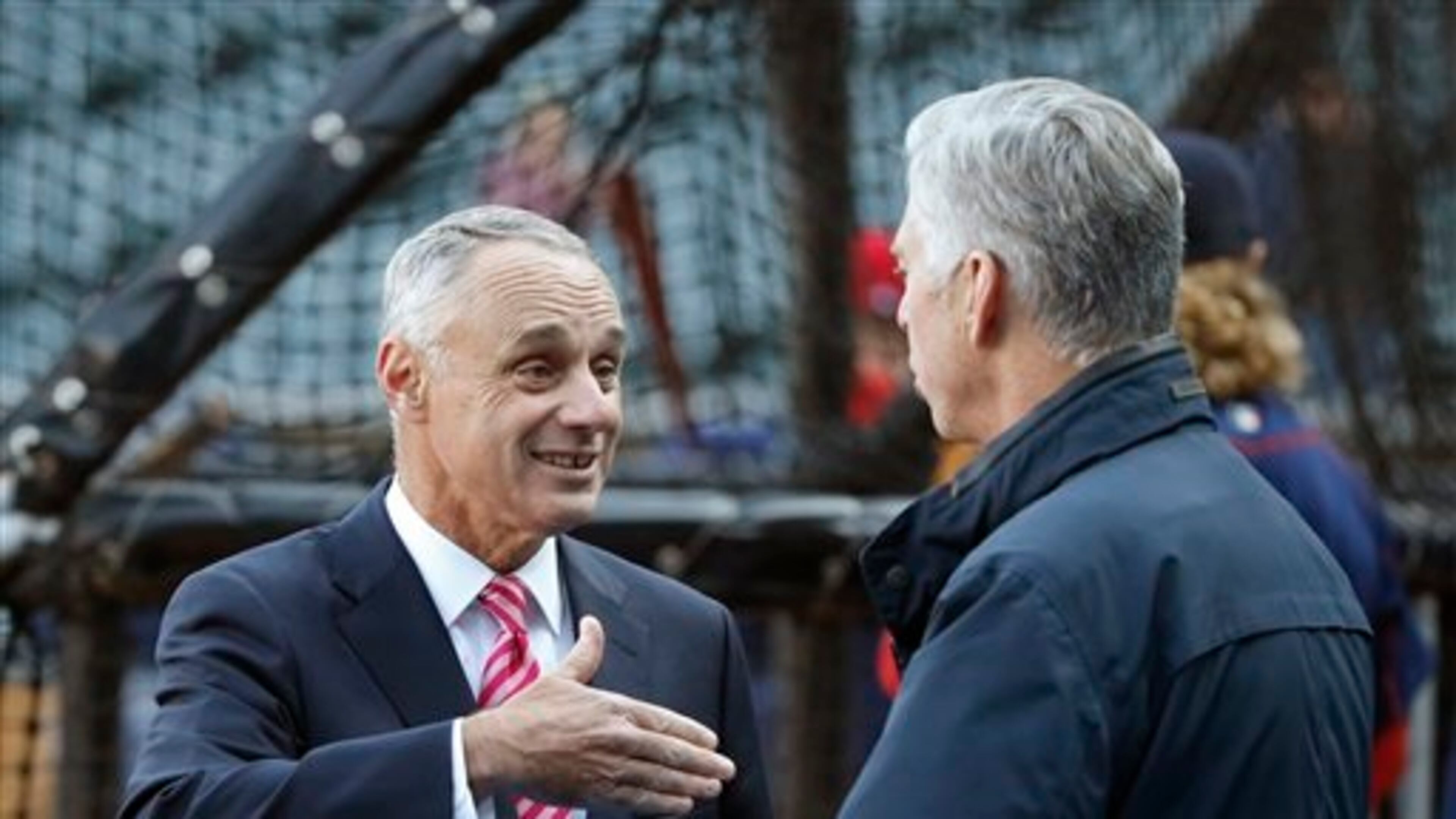 In this file photo, Major League Baseball commissioner Rob Manfred, left, talks with Boston Red Sox president of baseball operations Dave Dombrowski before a baseball game between the Chicago White Sox and the Red Sox Thursday, May 5, 2016, in Chicago. (AP Photo/Charles Rex Arbogast)