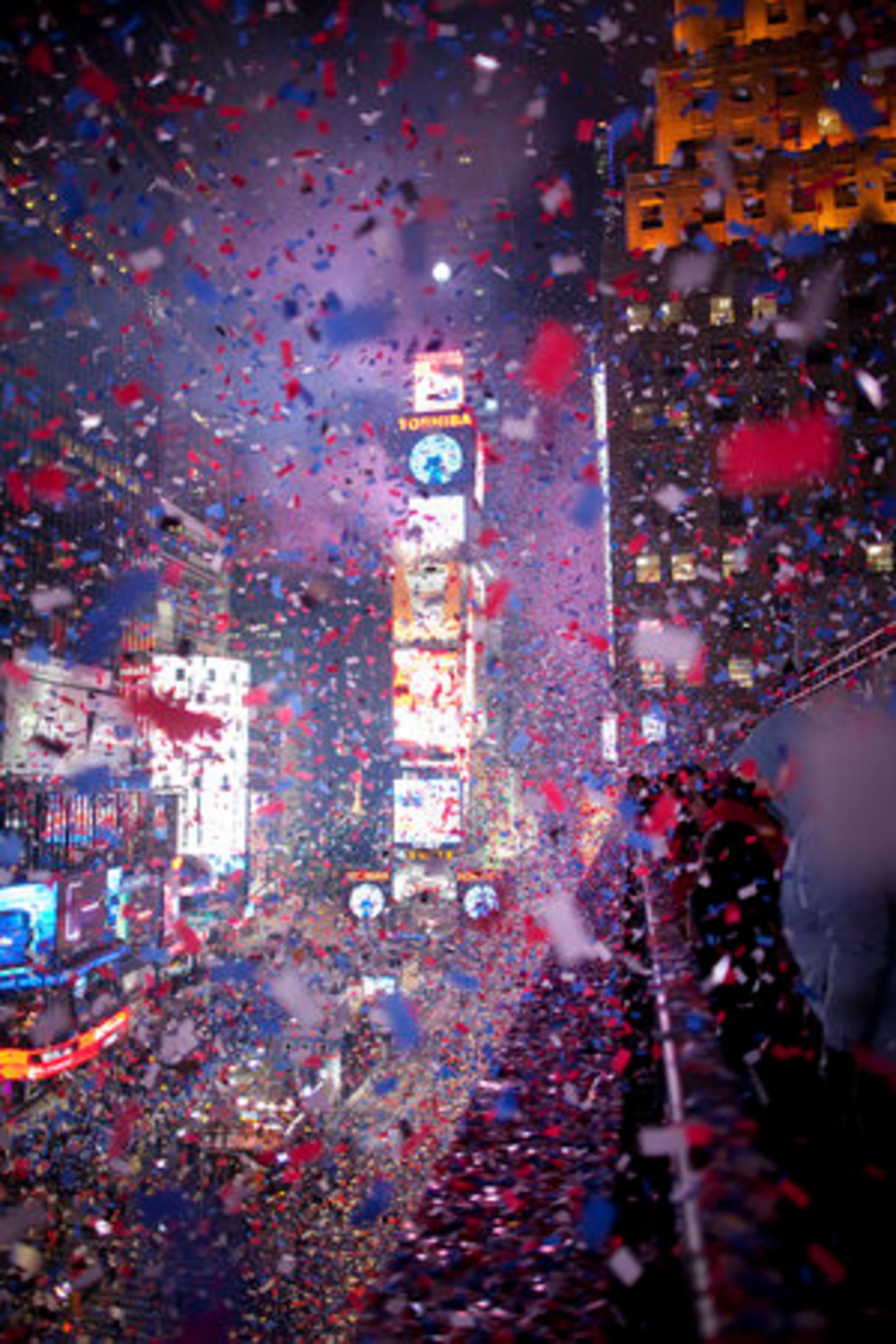 Confetti flies over Times Square during the New Year's Eve celebration in New York, Dec. 31, 2010. The square is an annual gathering place to watch the Waterford Crystal Times Square New Year's Eve Ball drop on top of One Times Square in a countdown to midnight.