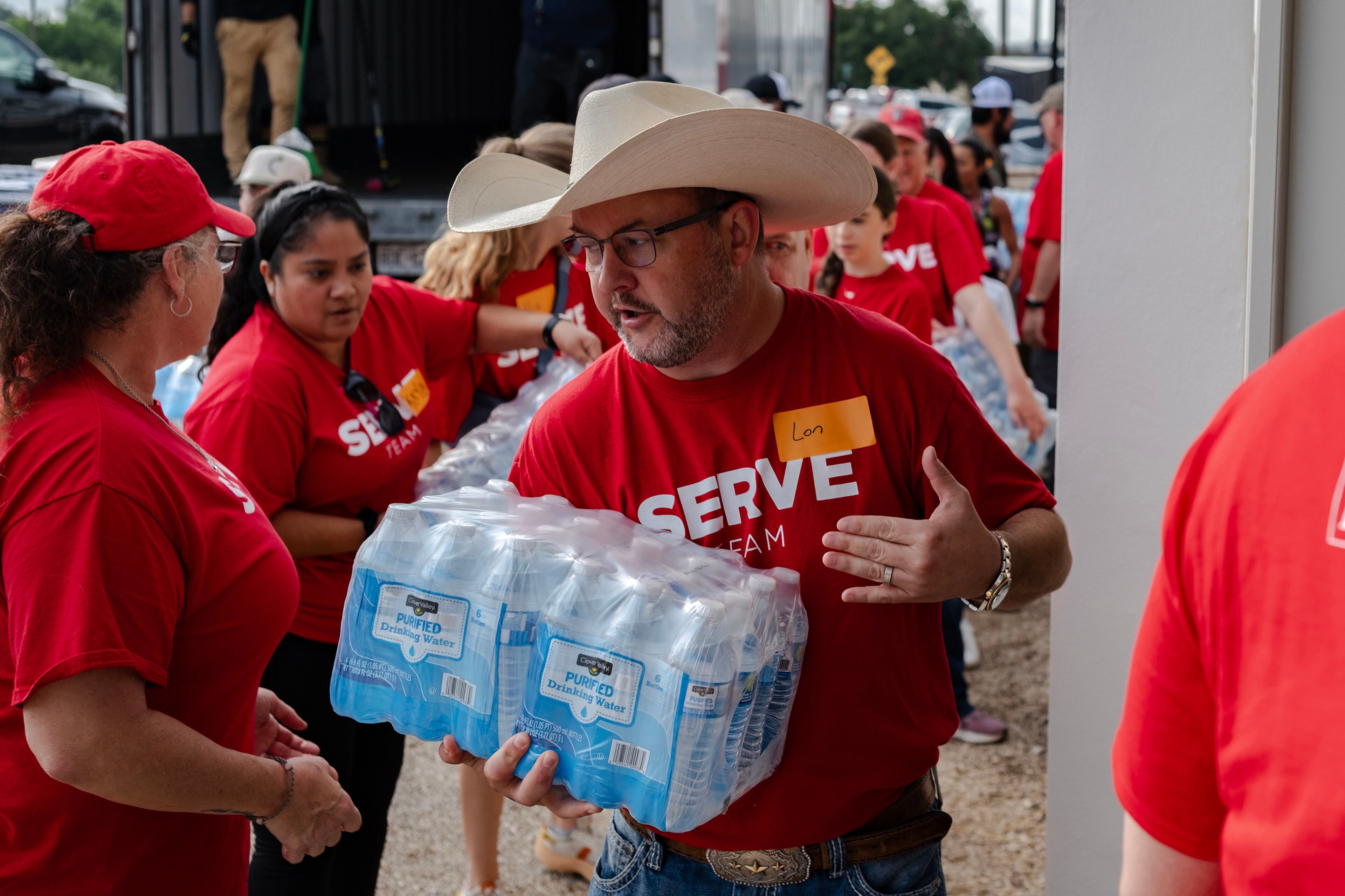 Volunteers unload a semi-truck full of supplies delivered by Convoy of Hope to Gateway Kerrville Church in Ingram, Texas, for those who were affected by the deadly flash flooding on Monday, July 7, 2025. (Jim Vondruska/Getty Images/TNS)