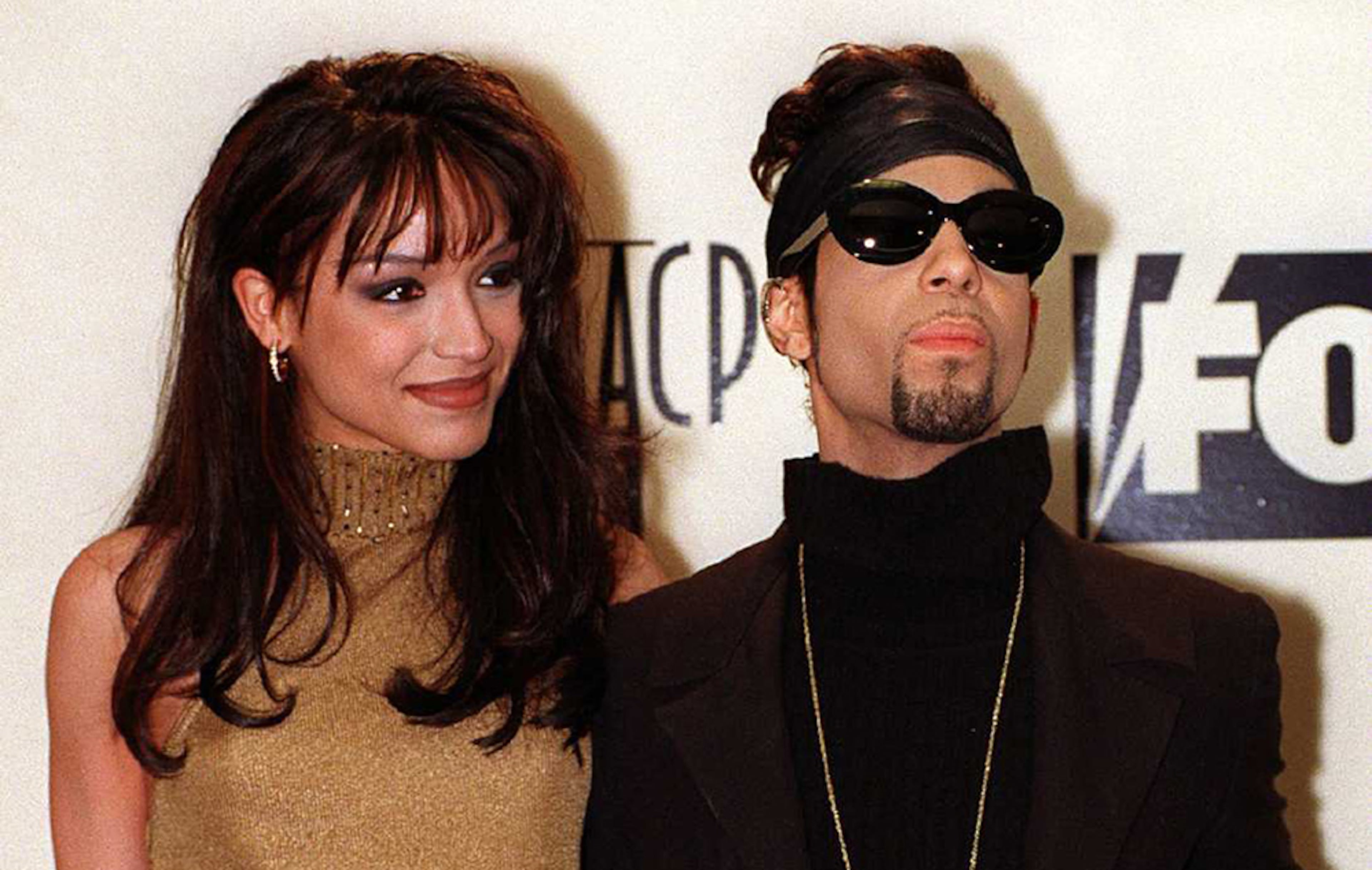 The Artist Formerly Known as Prince poses backstage with his new wife Mayte at the 28th annual NAACP Image Awards ceremony Saturday, Feb. 8, 1997, in Pasadena, Calif. This year's theme for the show is 'Celebration of Family.'