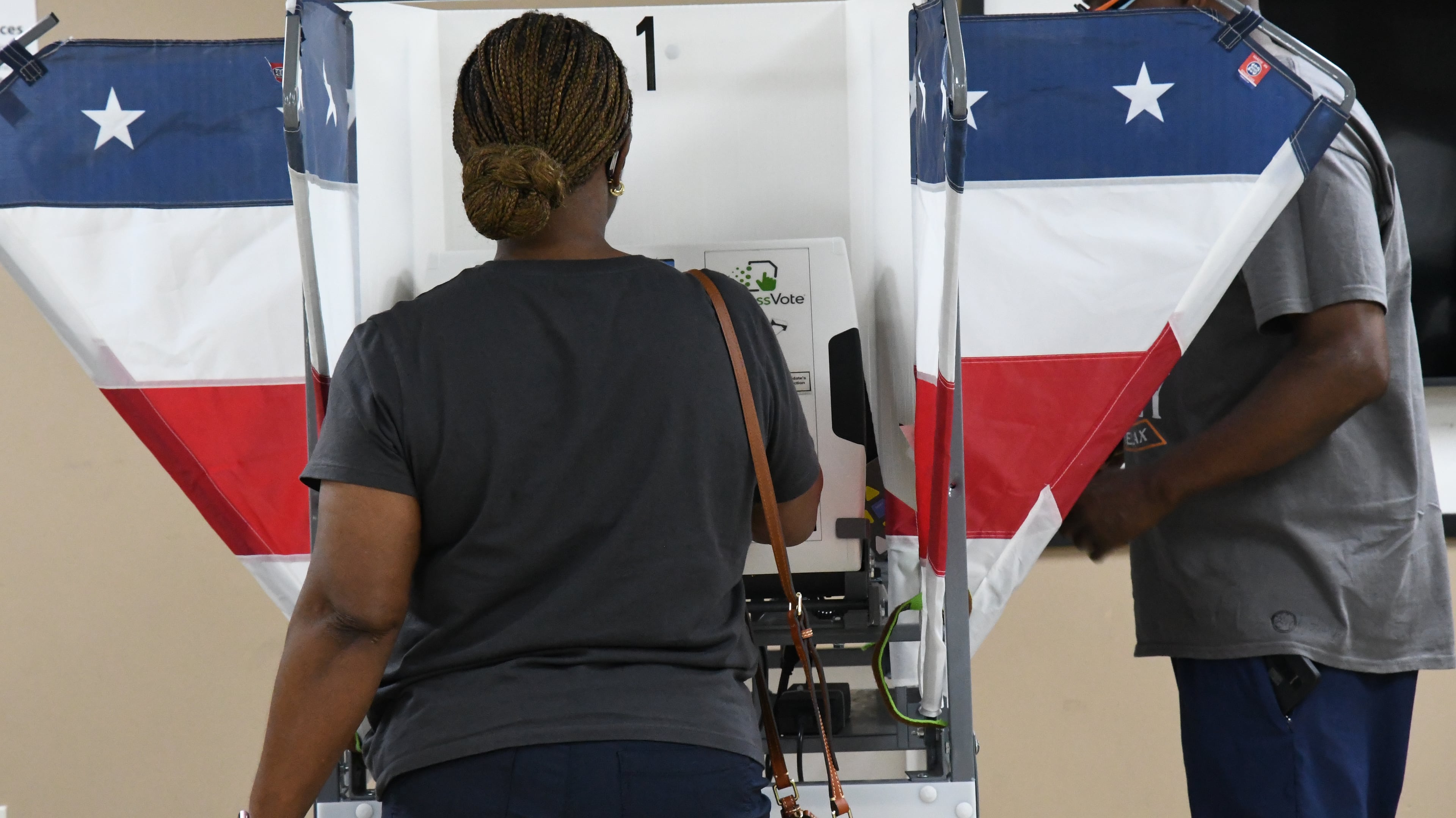 Two voters fill out their ballots in Memphis, Tenn., Wednesday, July 22, 2026. (AP Photo/Kristin M. Hall)